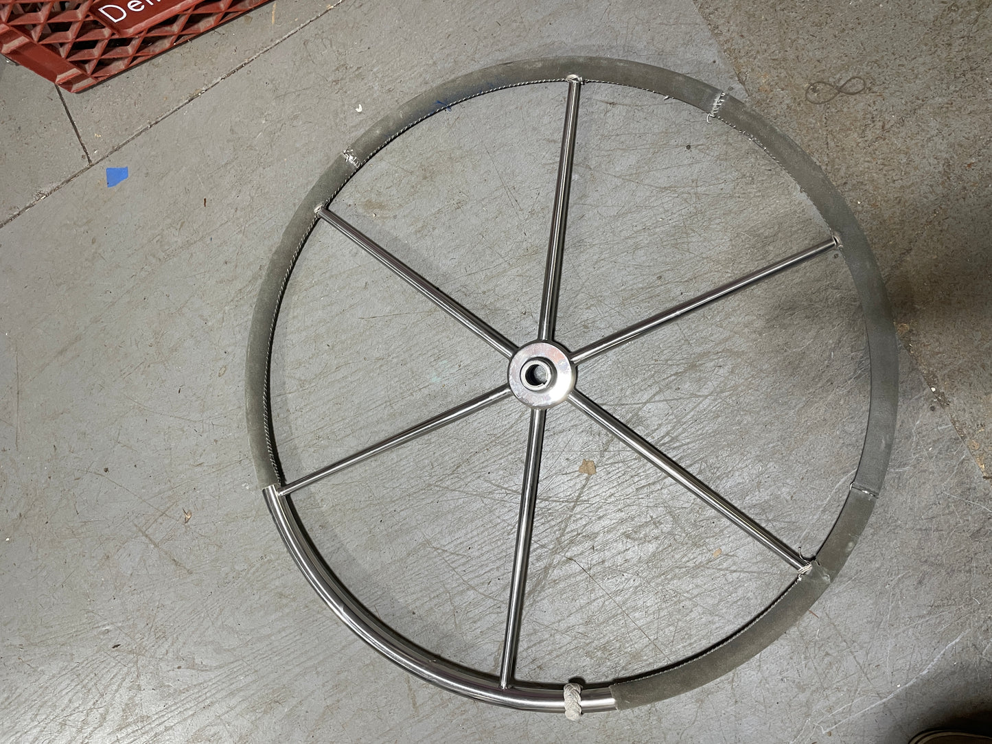 Metal wheel rim on a concrete floor