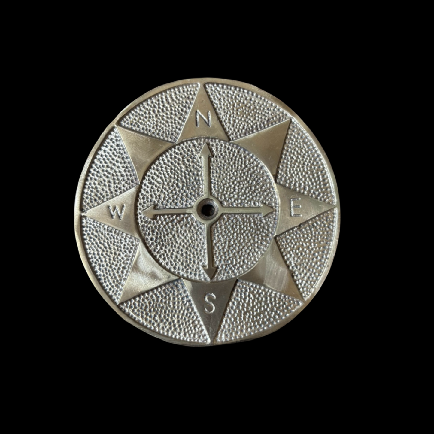 Decorative compass design on a black background