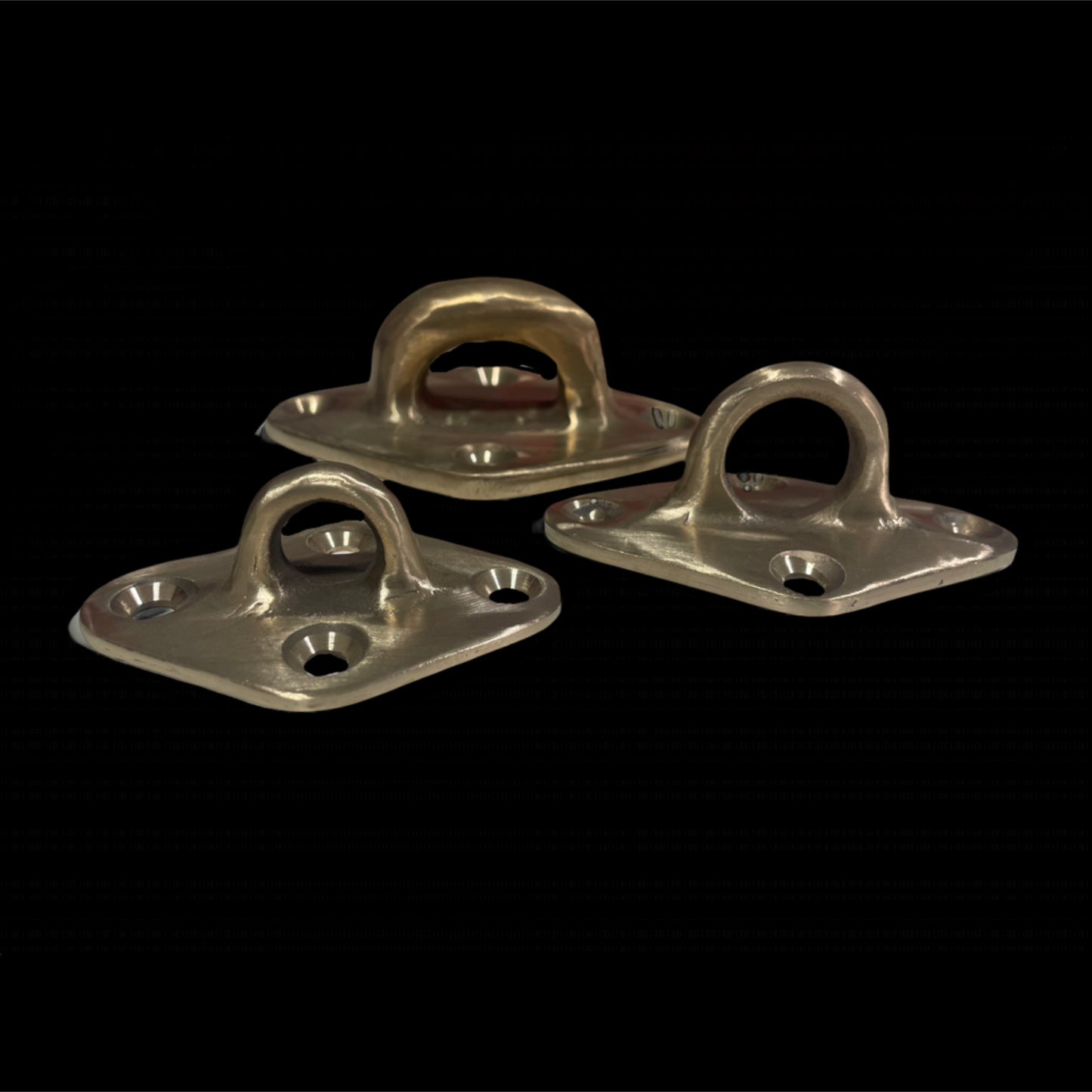 Three metallic brackets on a black background