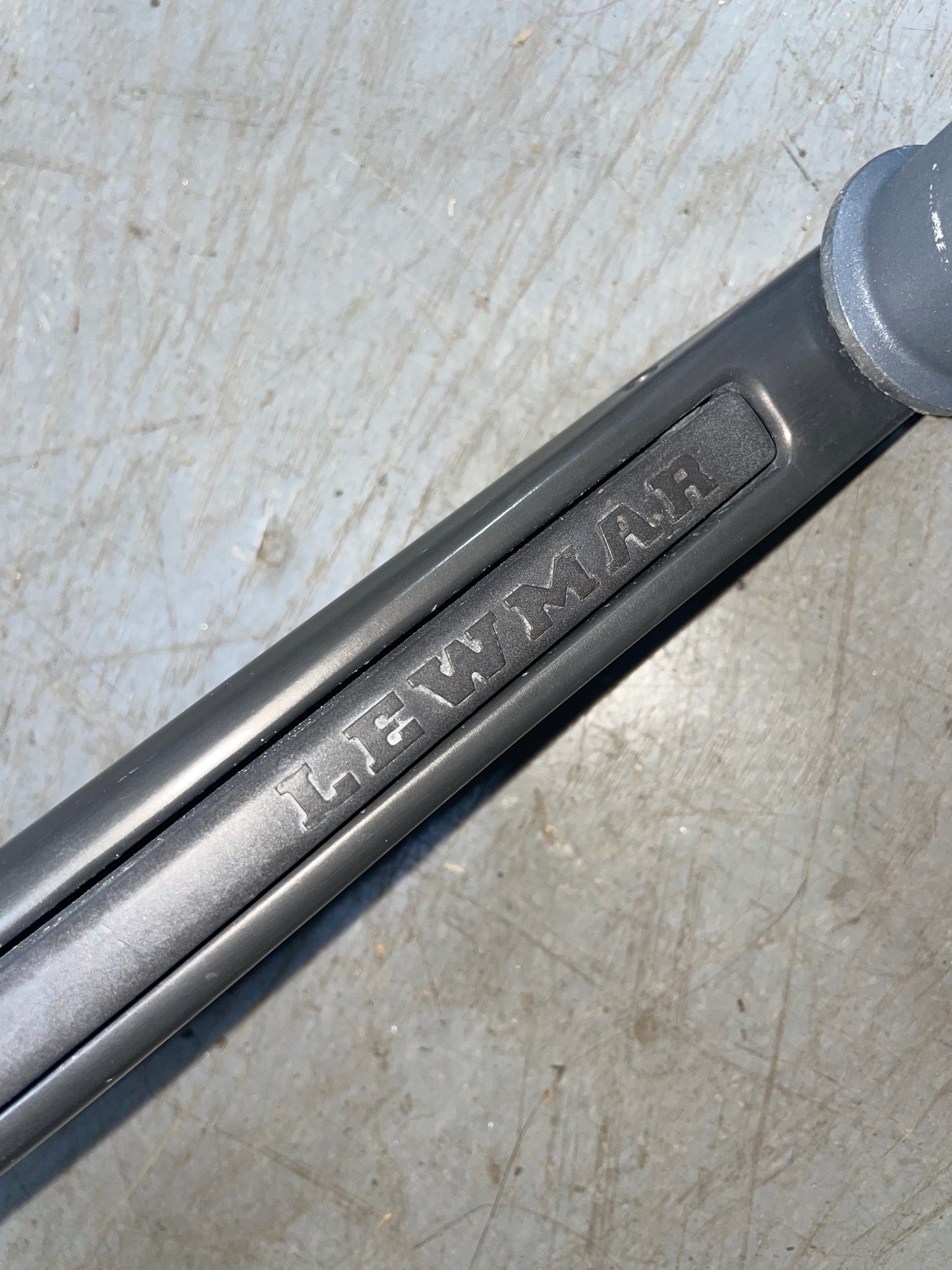 Metal wrench on a textured surface