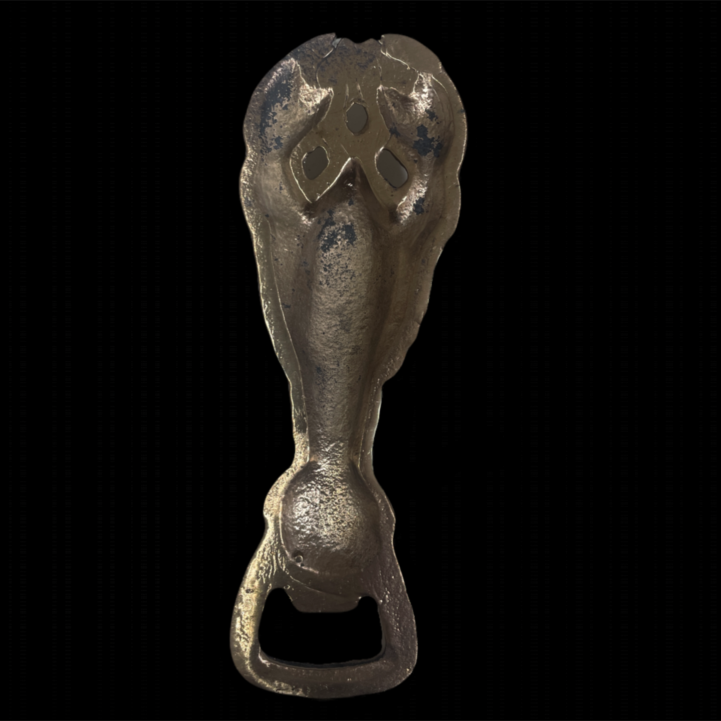 Decorative bottle opener with intricate design on a black background