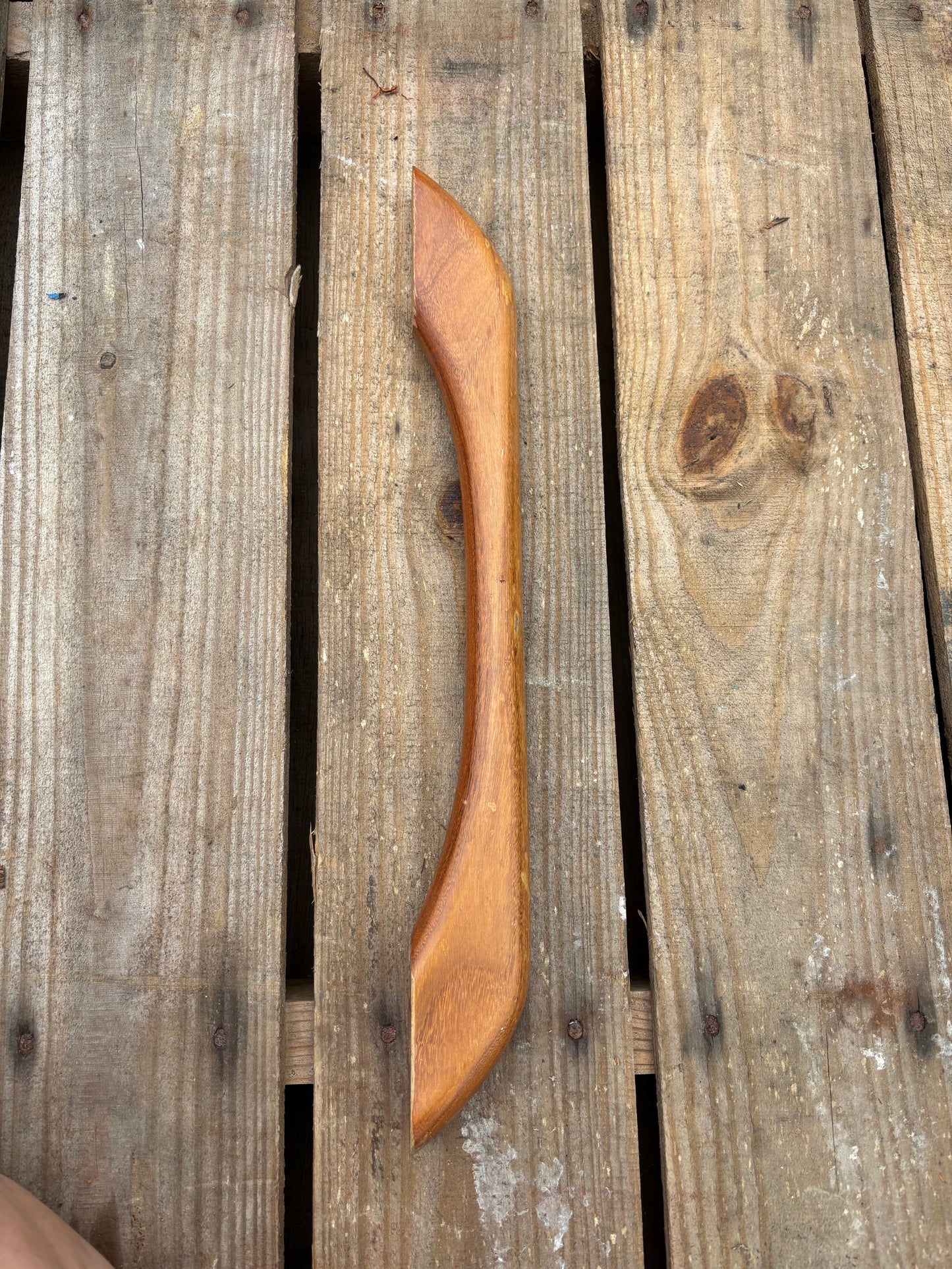 Wooden handle on a wooden surface