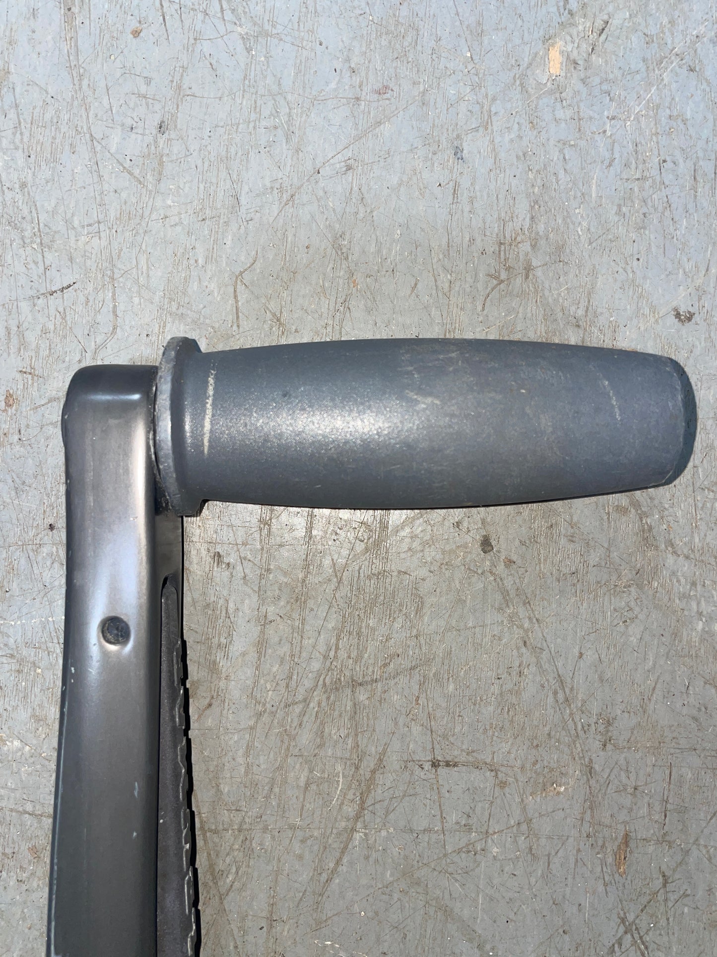 Metal tool handle on a textured surface