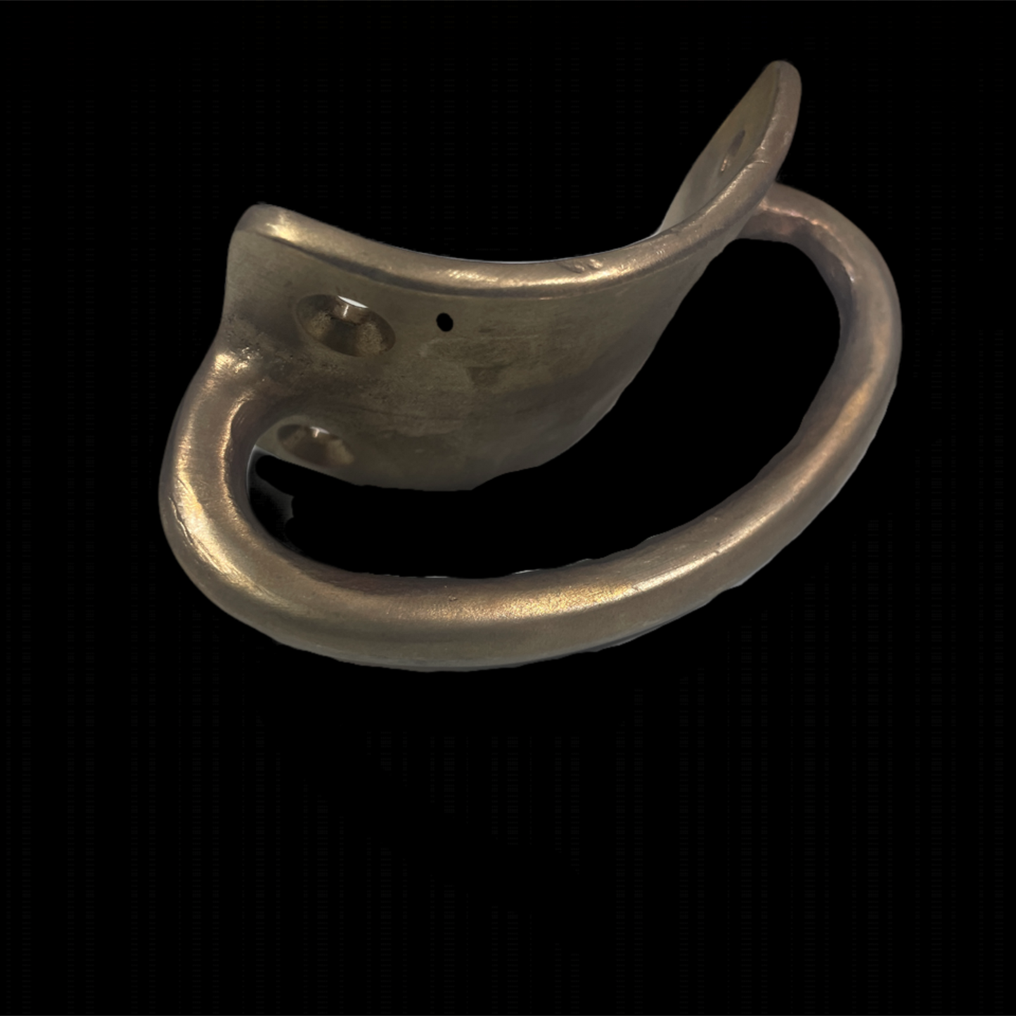 Metallic ring with a curved design on a black background