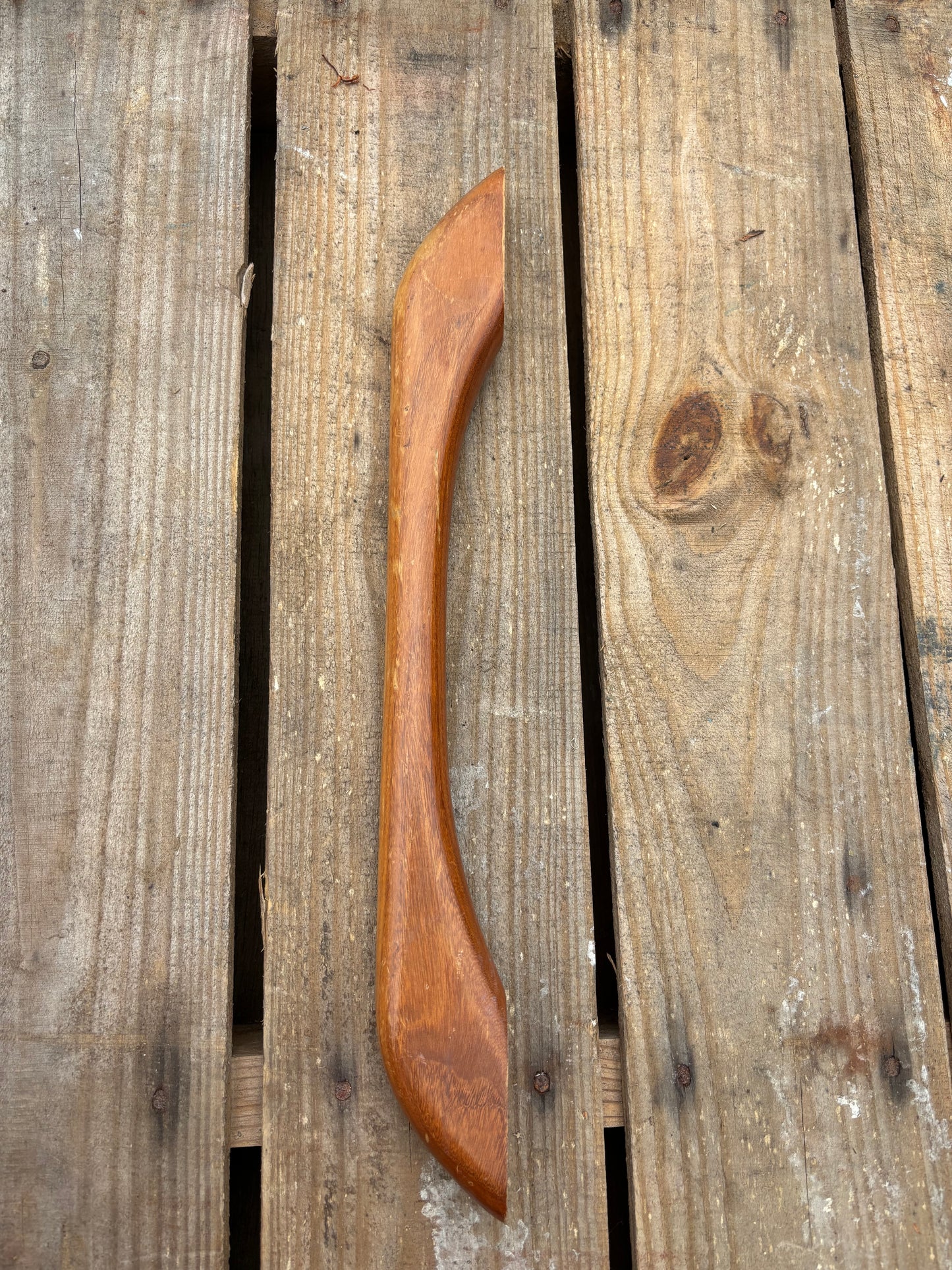 Wooden hand rail on wooden surface
