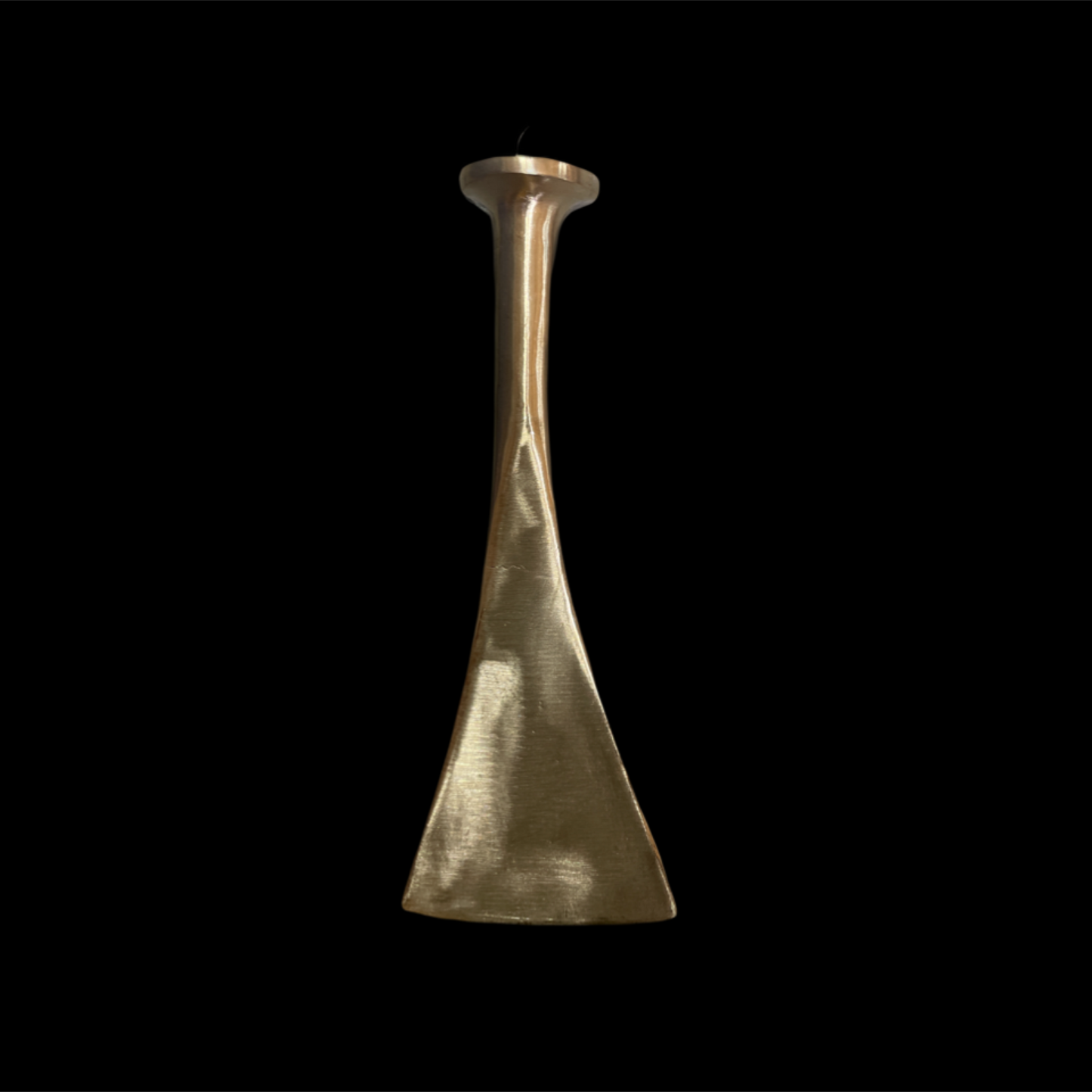 Gold metallic vase on a black background