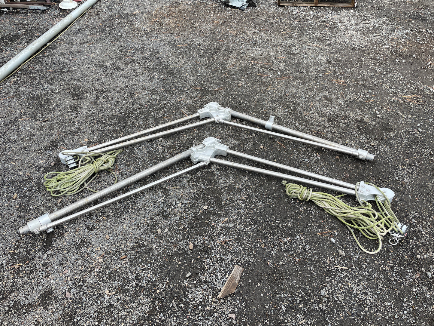 Set of metal rods with rope attachments on a concrete surface