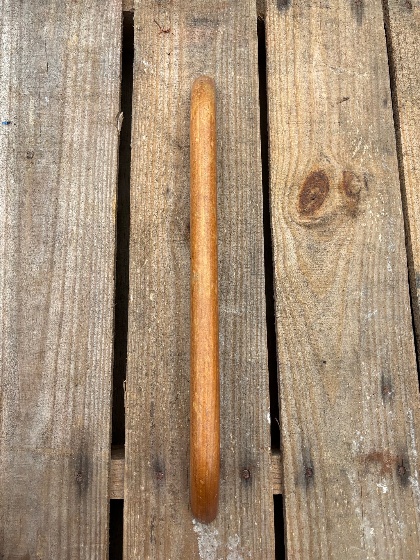 Wooden hand rail on wooden surface