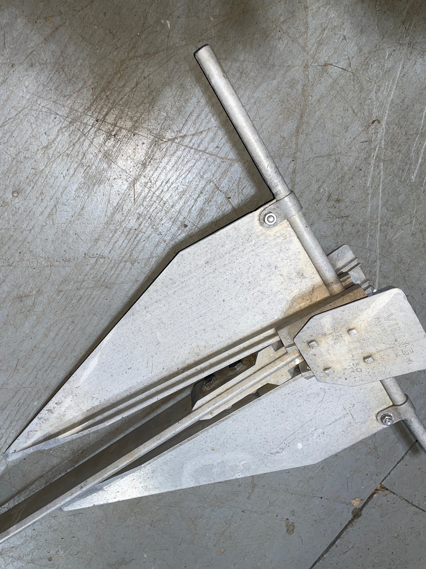 Metal anchor on a concrete surface