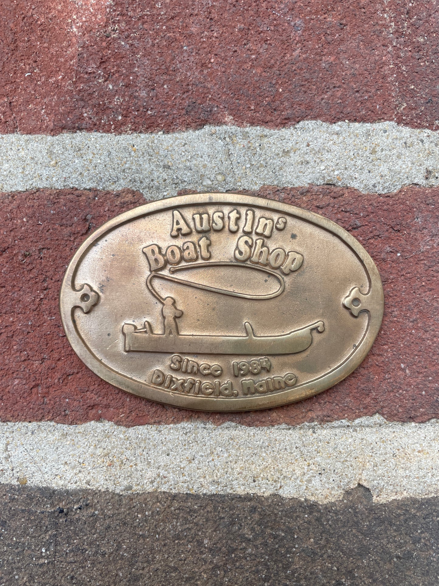 Bronze plaque on a brick surface