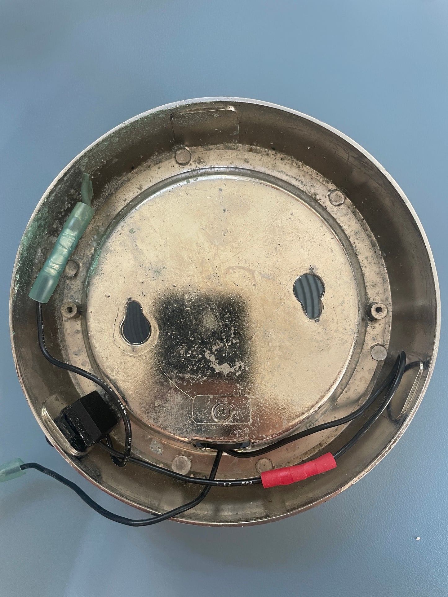 Metallic component with wires on a blue background
