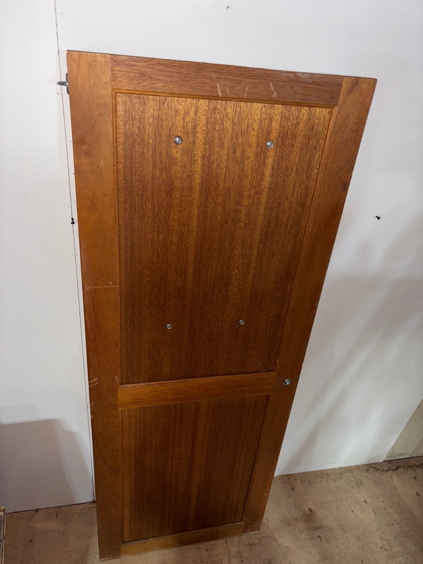 Wooden panel with a rectangular cutout on a white background