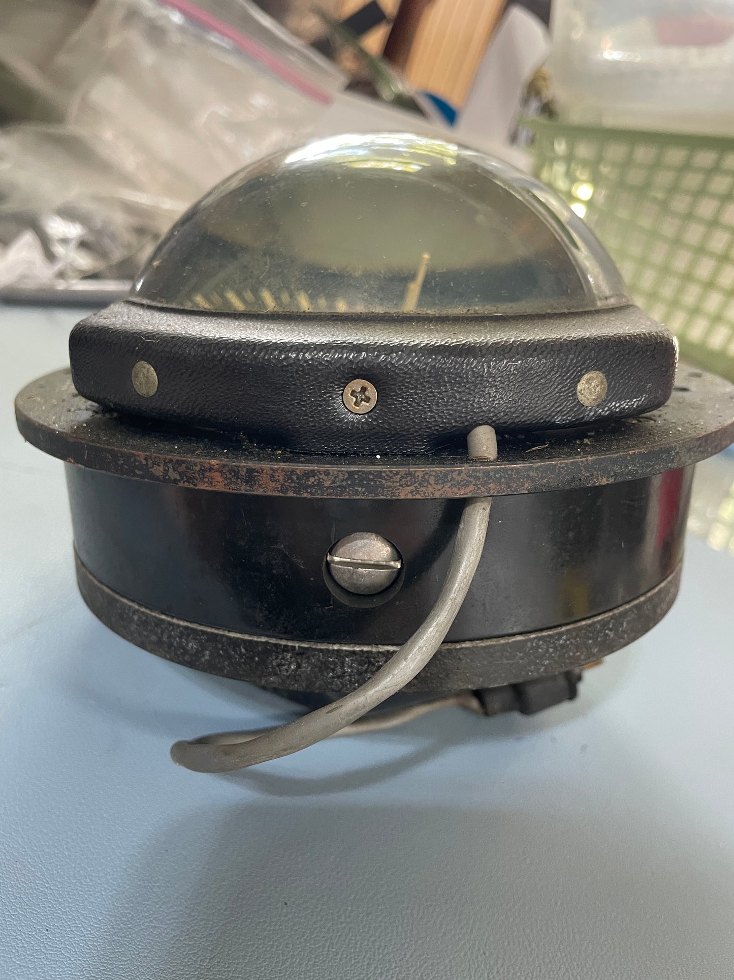 Vintage-style fishing reel on a white background