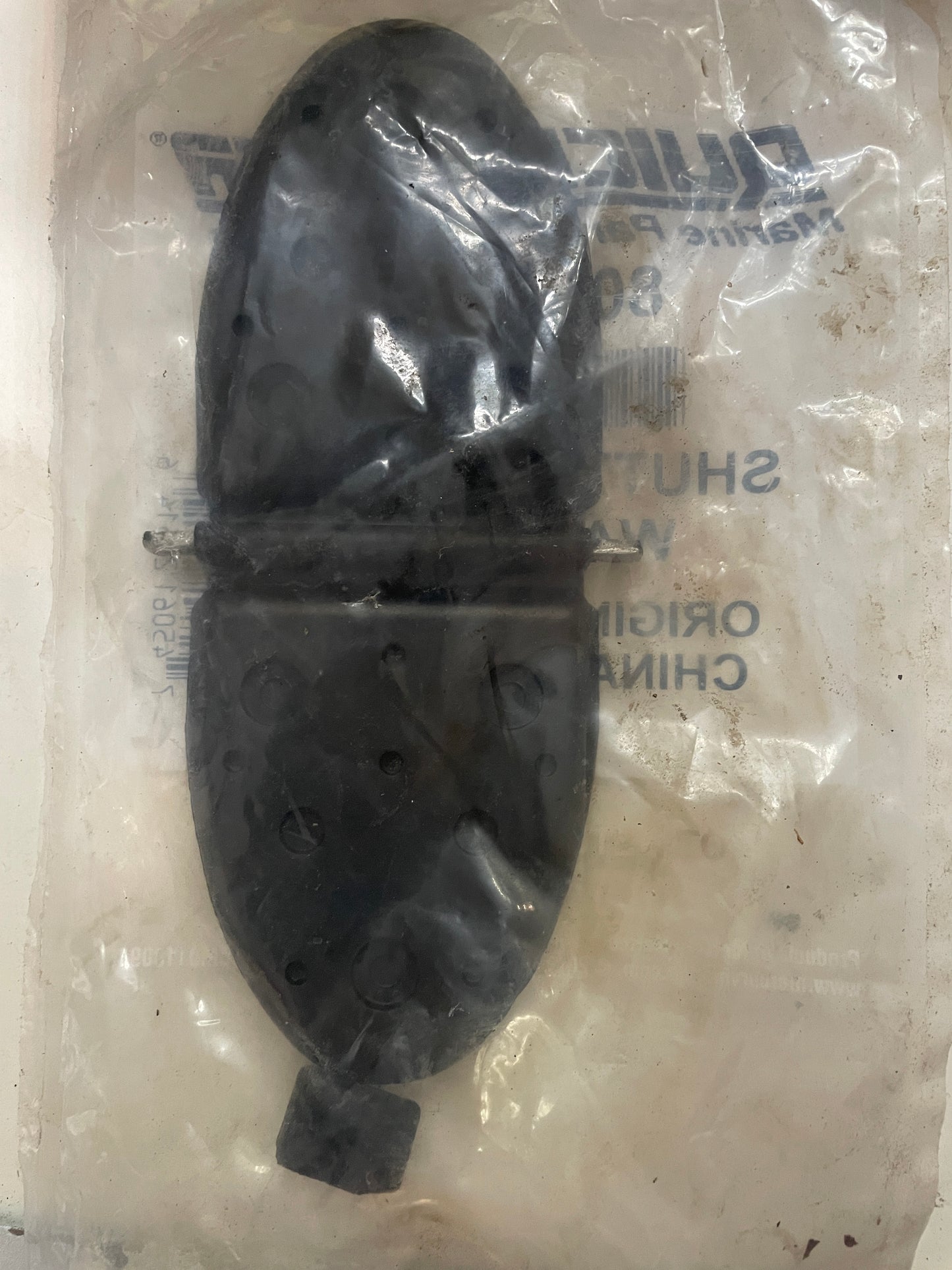 Black rubber part on a white background with visible branding