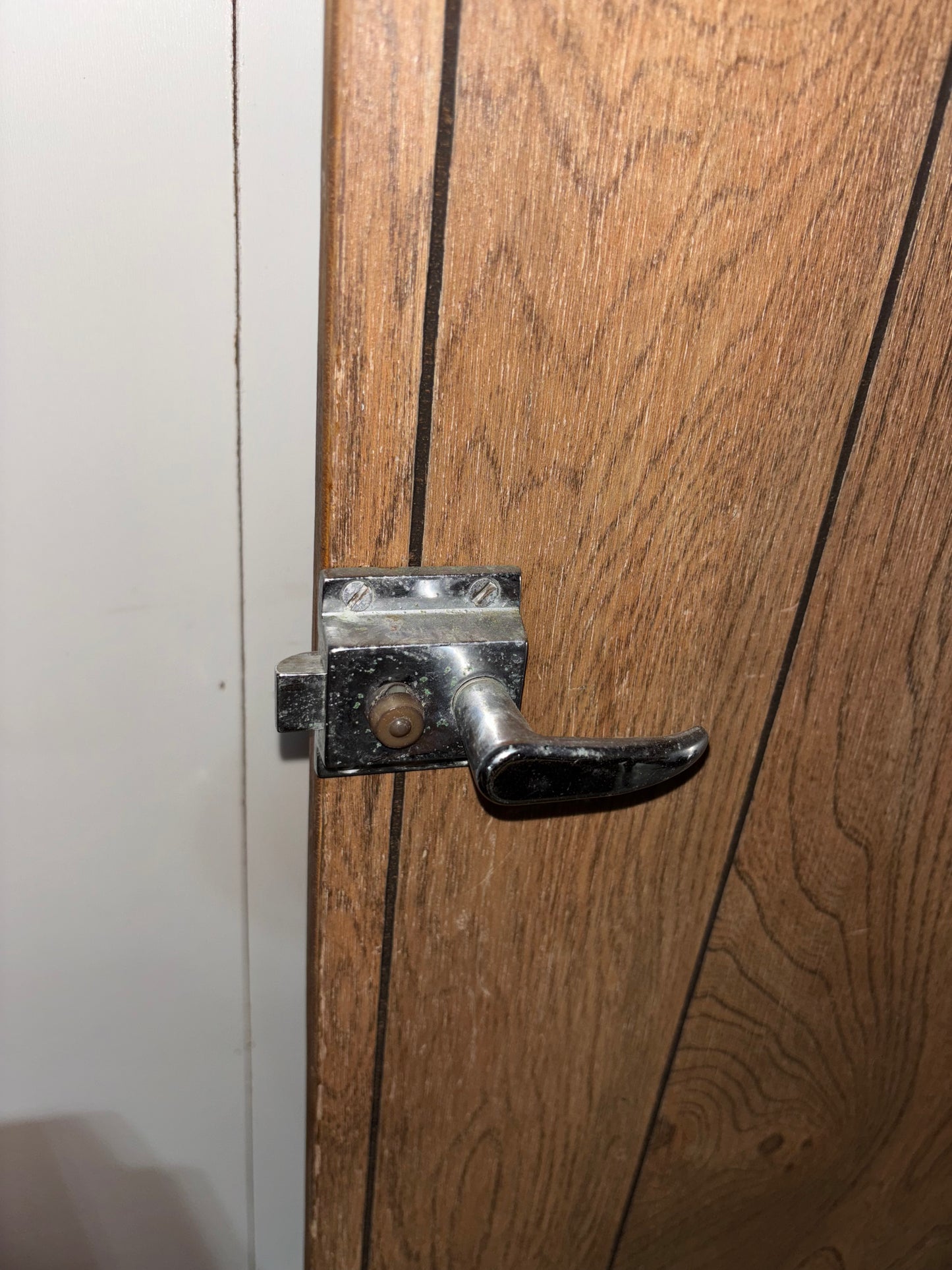 Wooden door with metal handle and lock mechanism