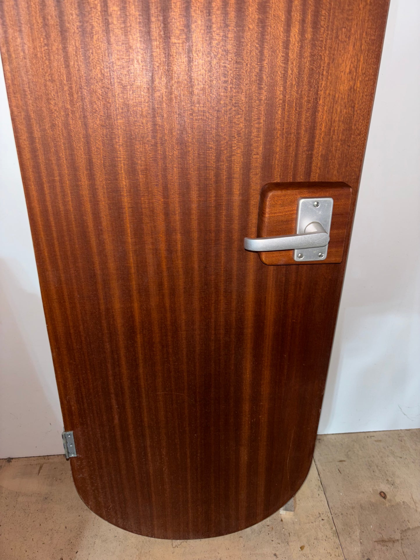 Wooden door with a handle on a white background