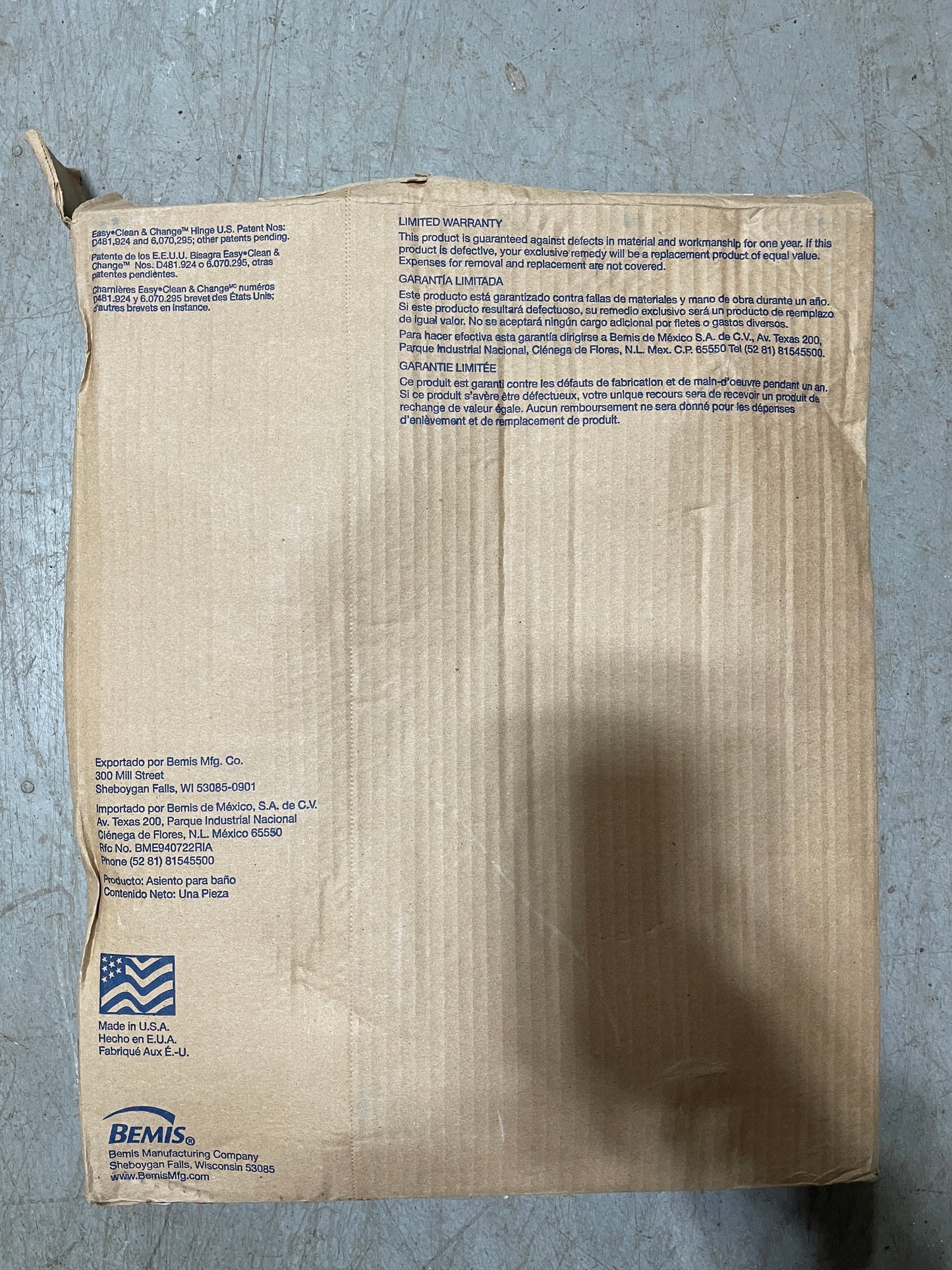 Brown paper bag with text on a gray surface