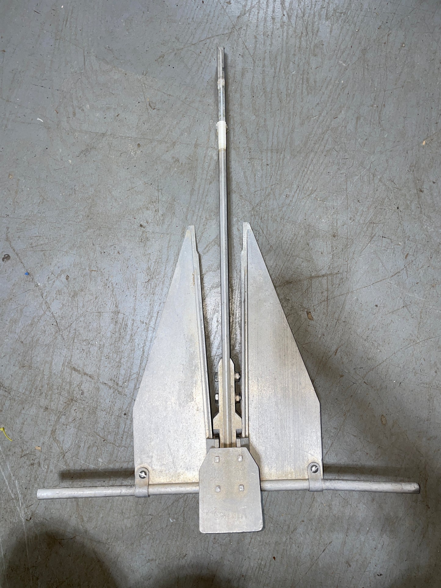 Metal tool on a textured gray surface
