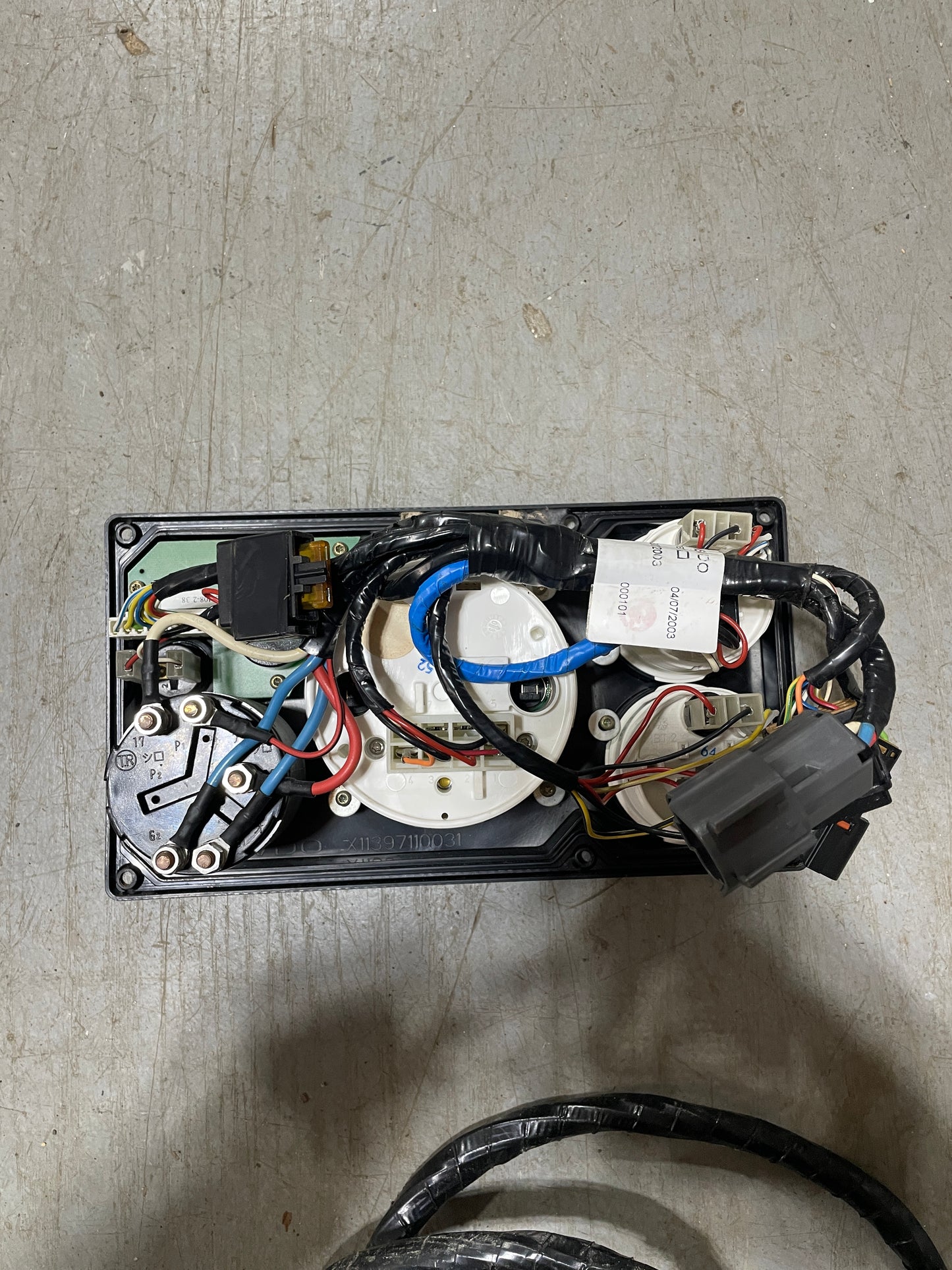 Electrical component with wires on a concrete surface