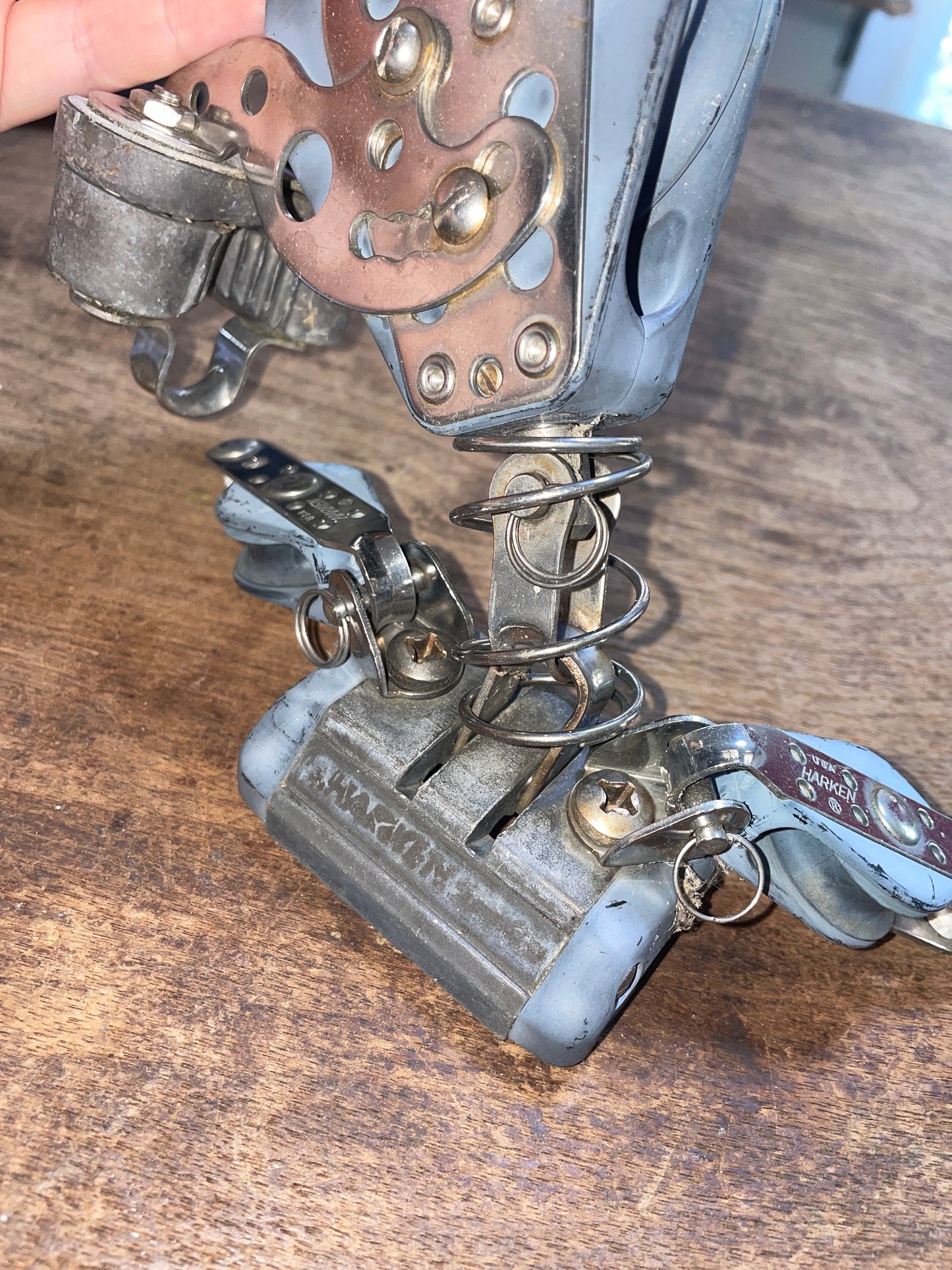 Close-up of a set of keys attached to a keychain on a wooden surface
