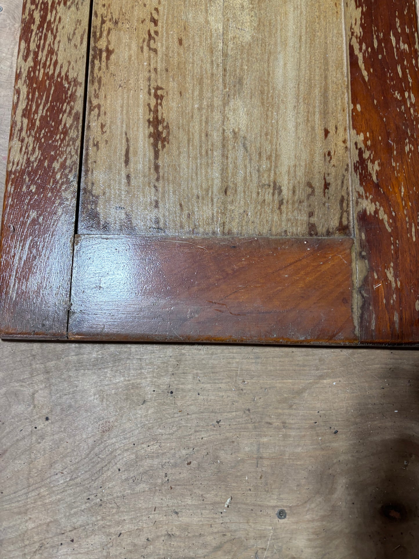 Close-up of a wooden surface with visible grain and wear