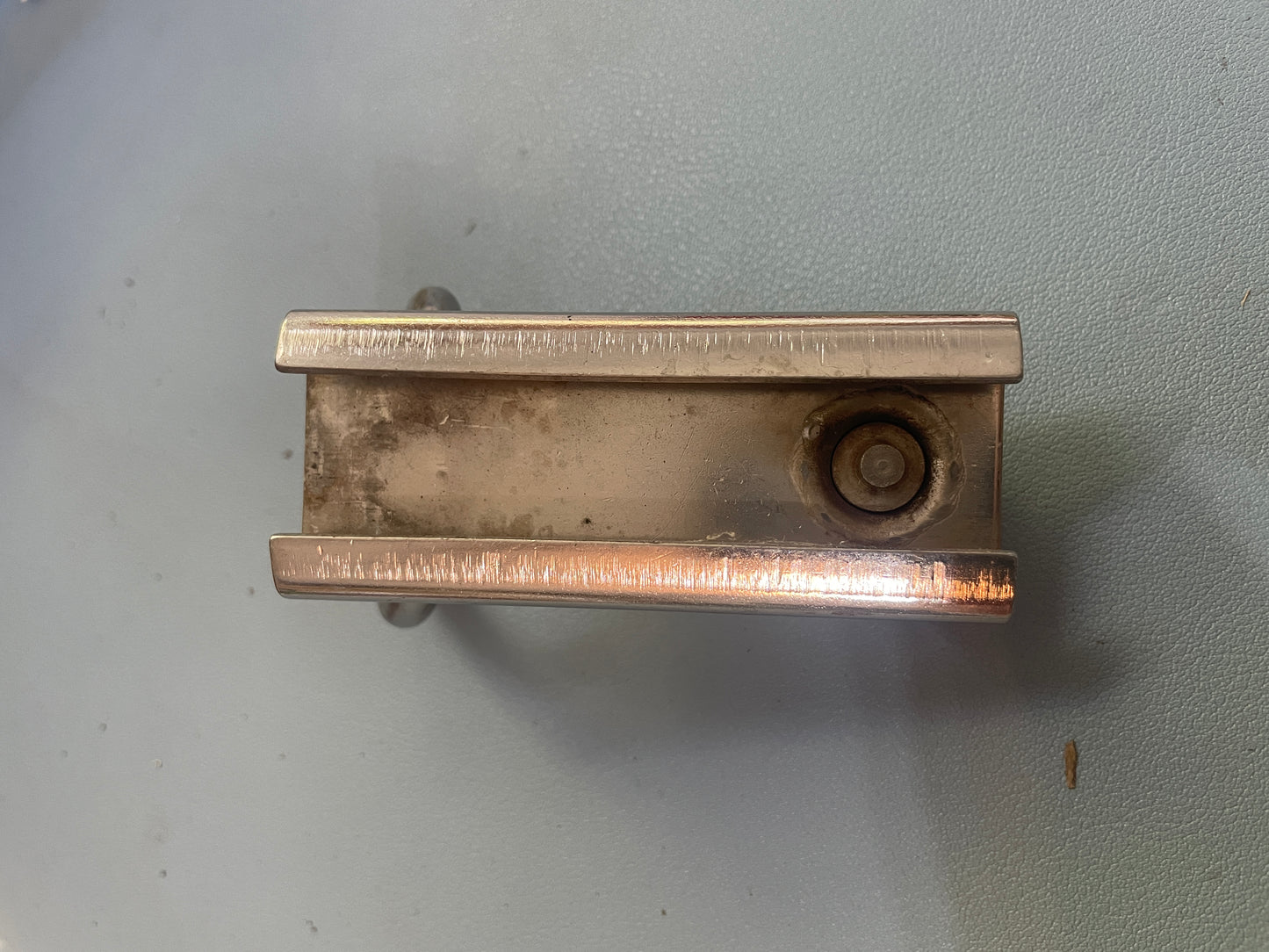 Metal bracket on a light gray background