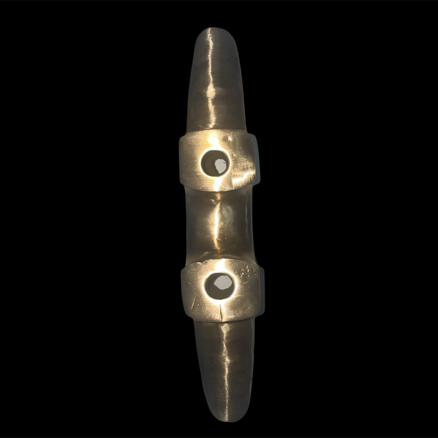 bottom view of bronze cleat