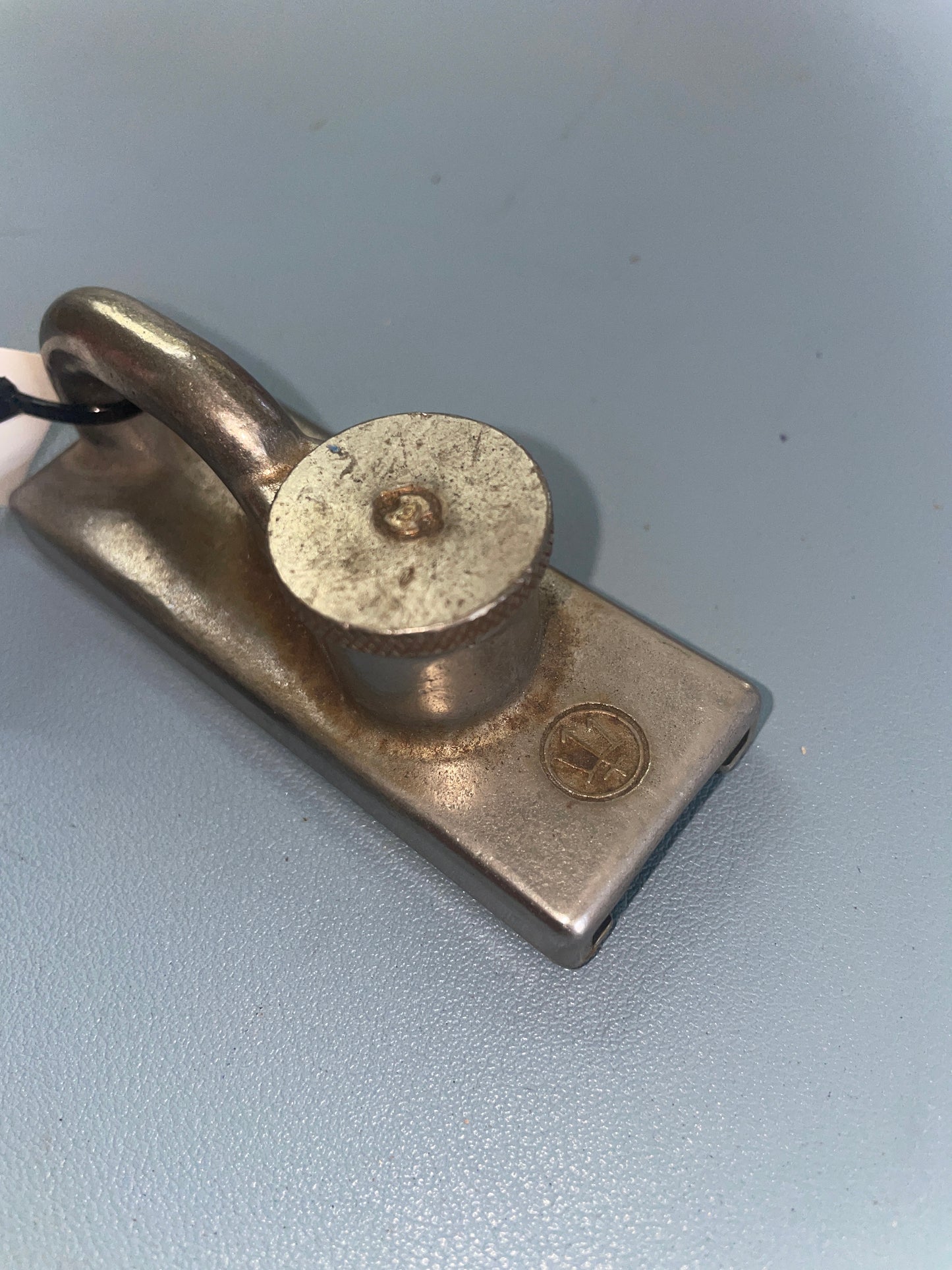 Metal latch on a gray background