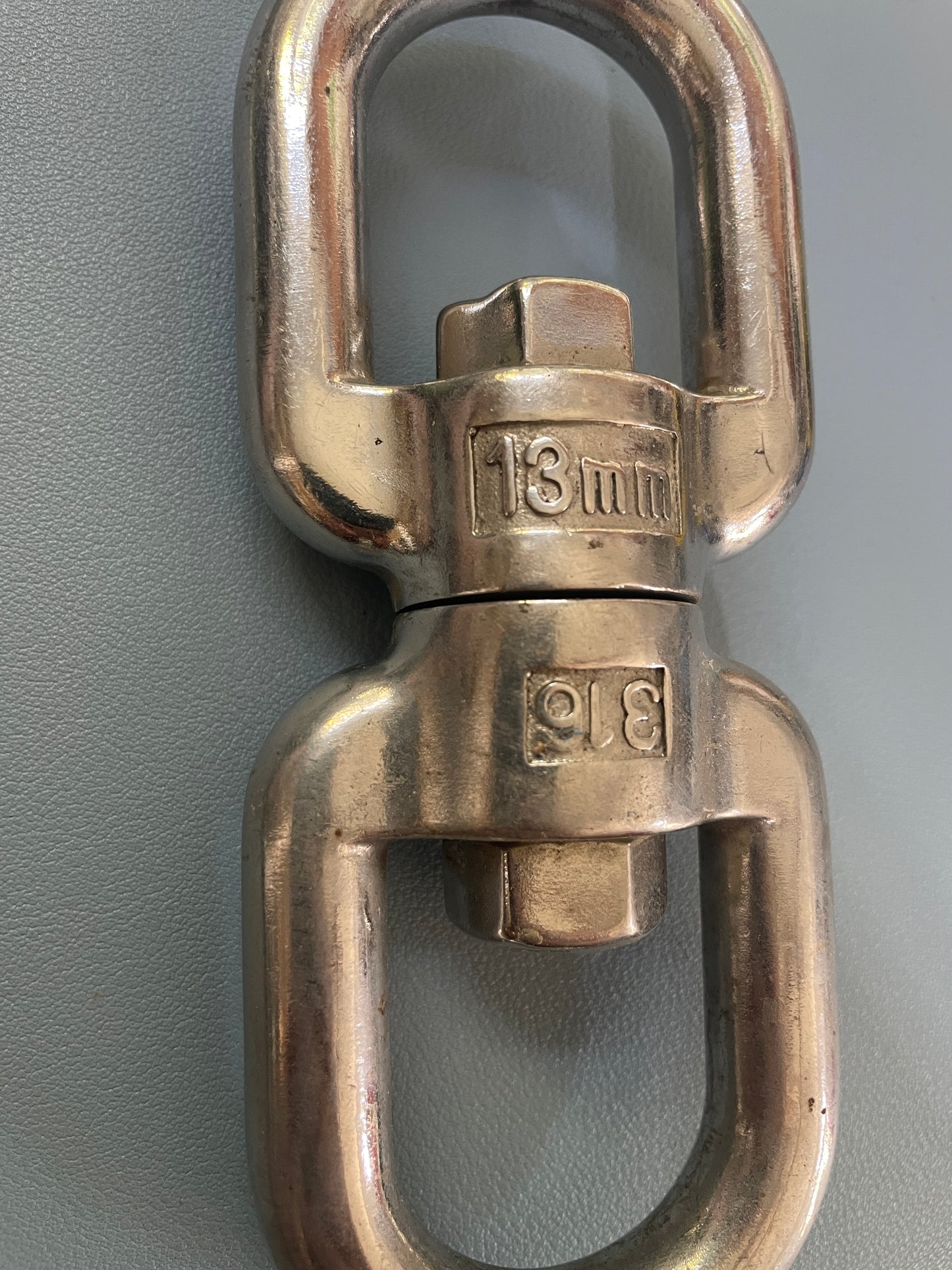 Metal shackle on a gray background