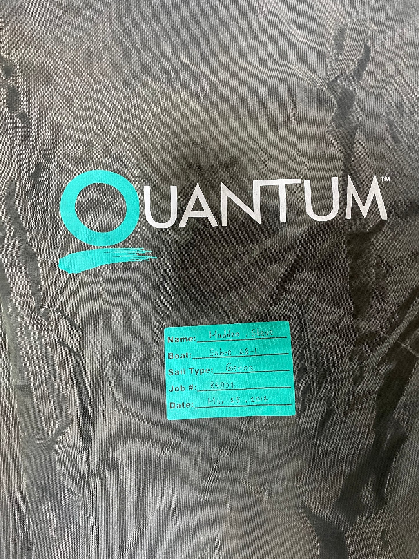 Dark fabric with 'Quantum' logo and label