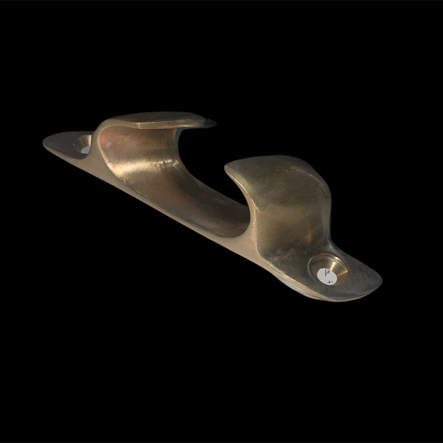 Bronze metal bracket on a black background