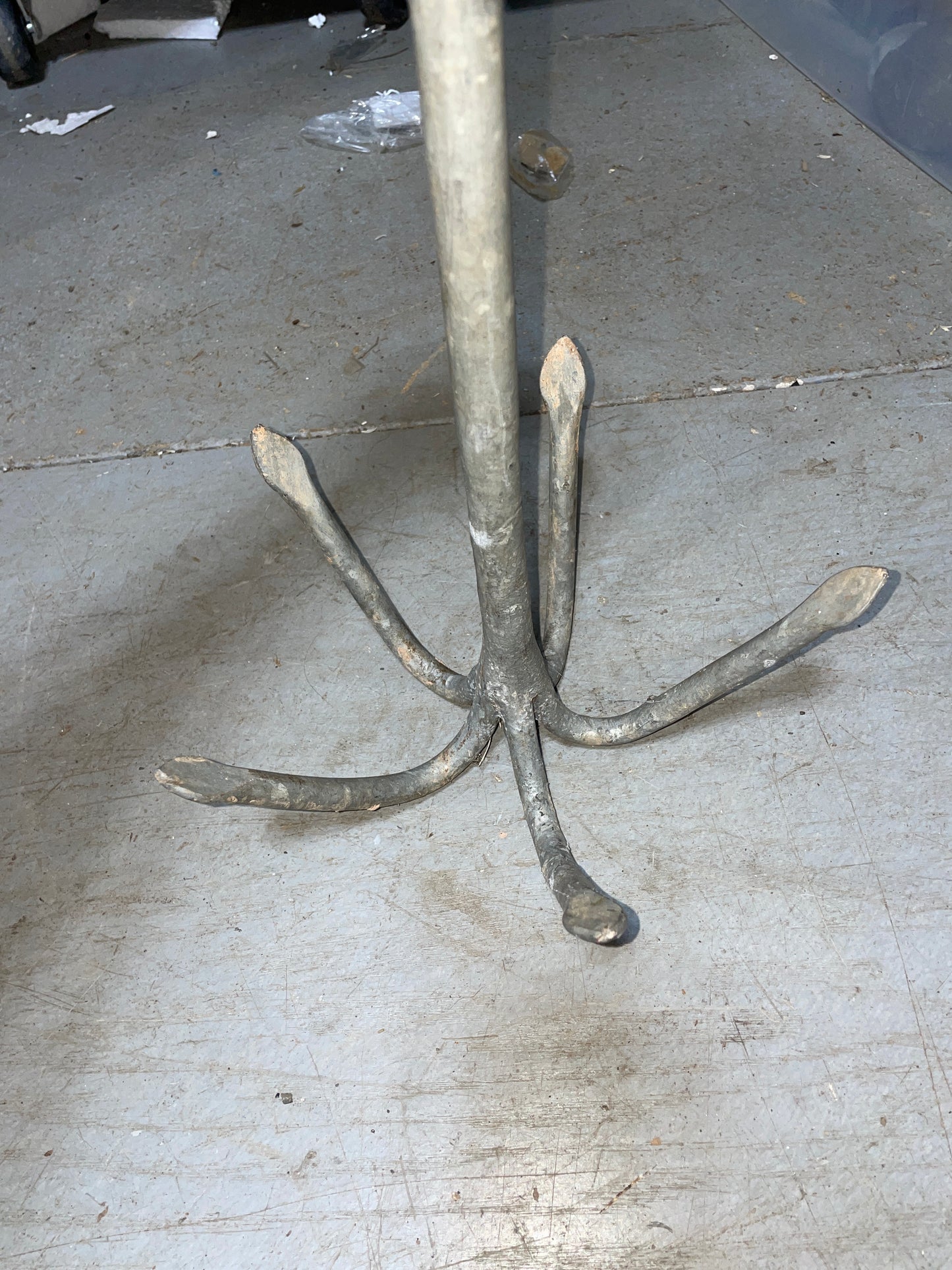 Metal anchor on a concrete floor