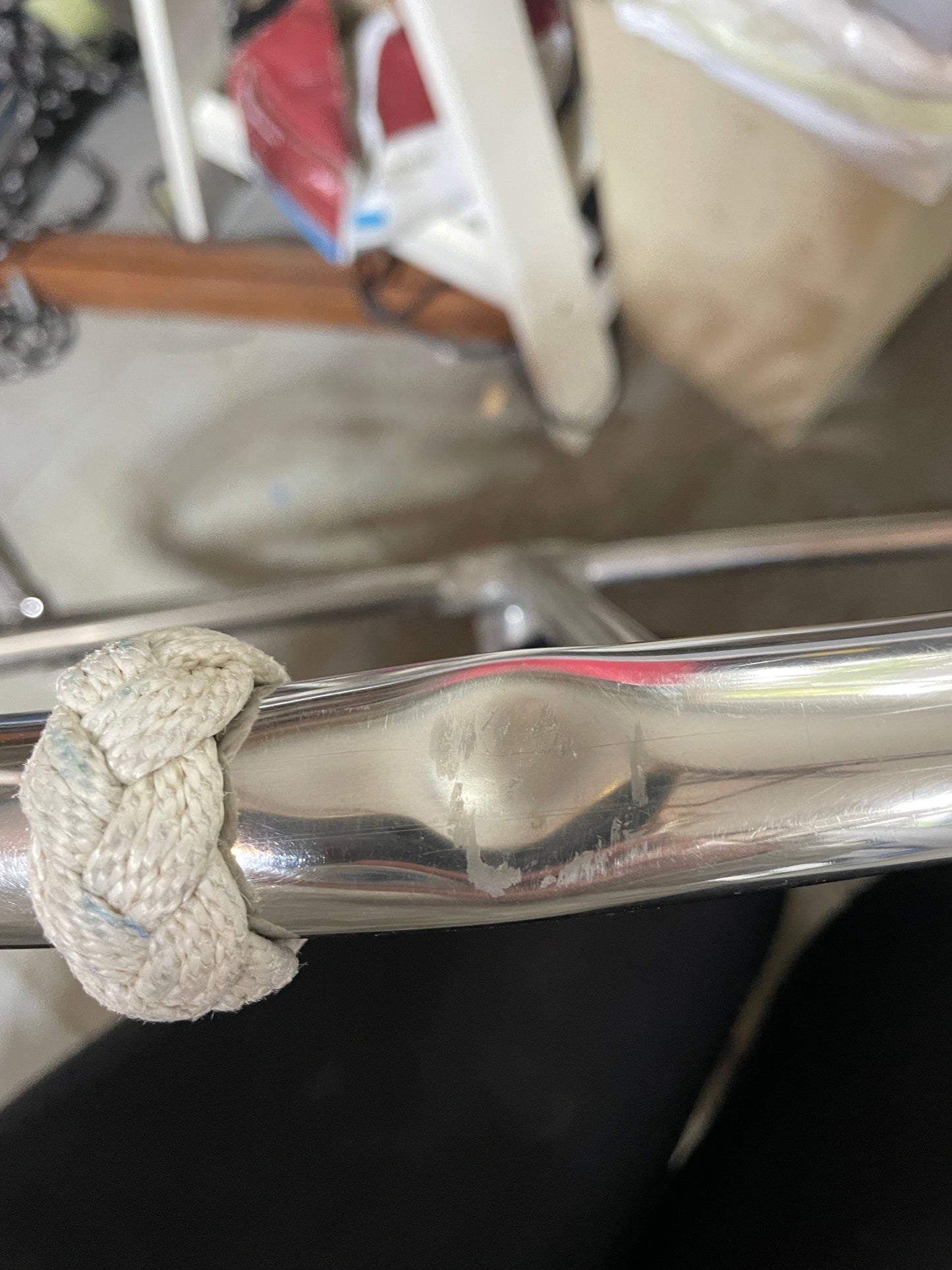 Metal handle with a knitted cover in a kitchen setting