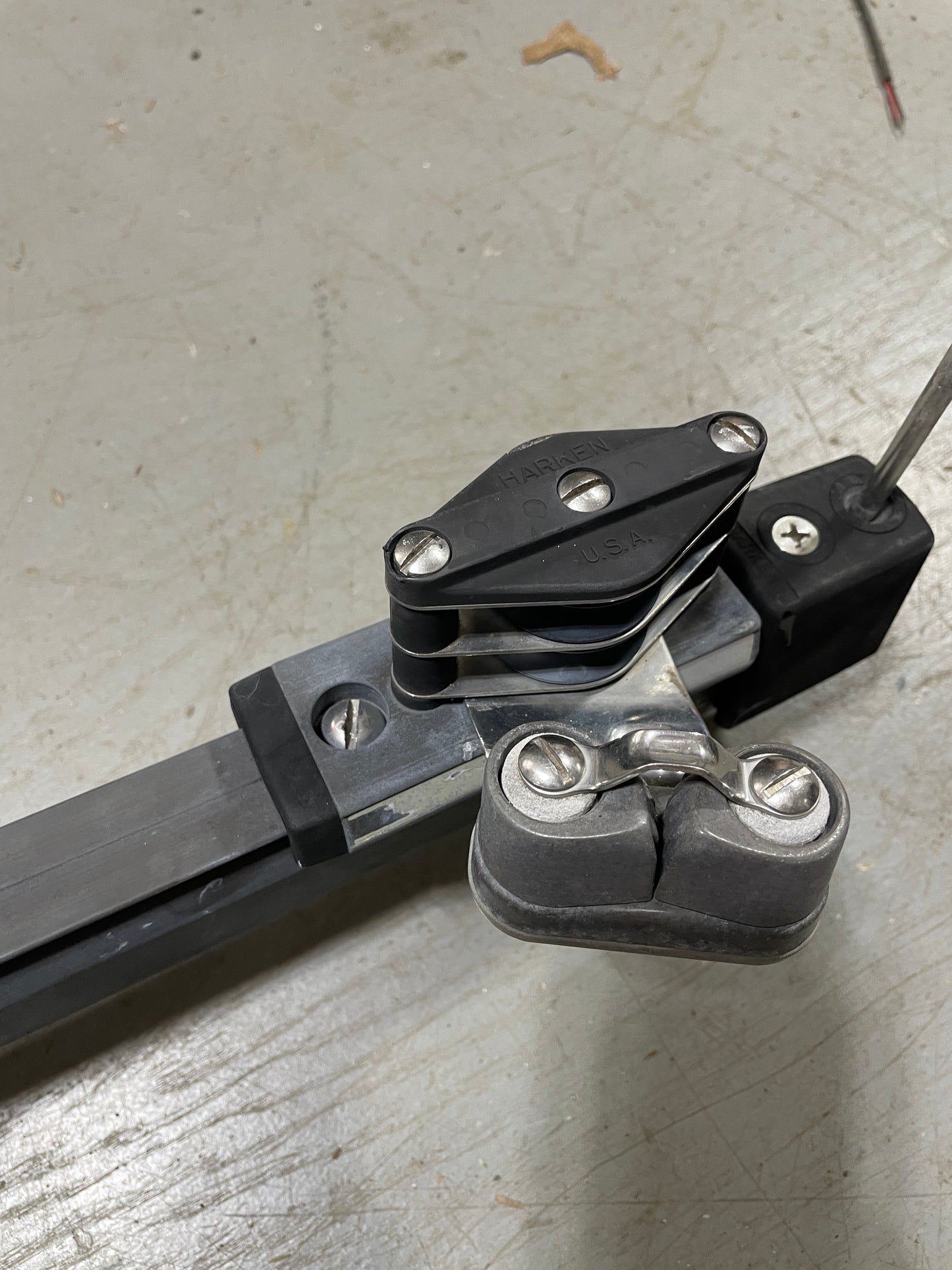Metal door hinge on a textured surface