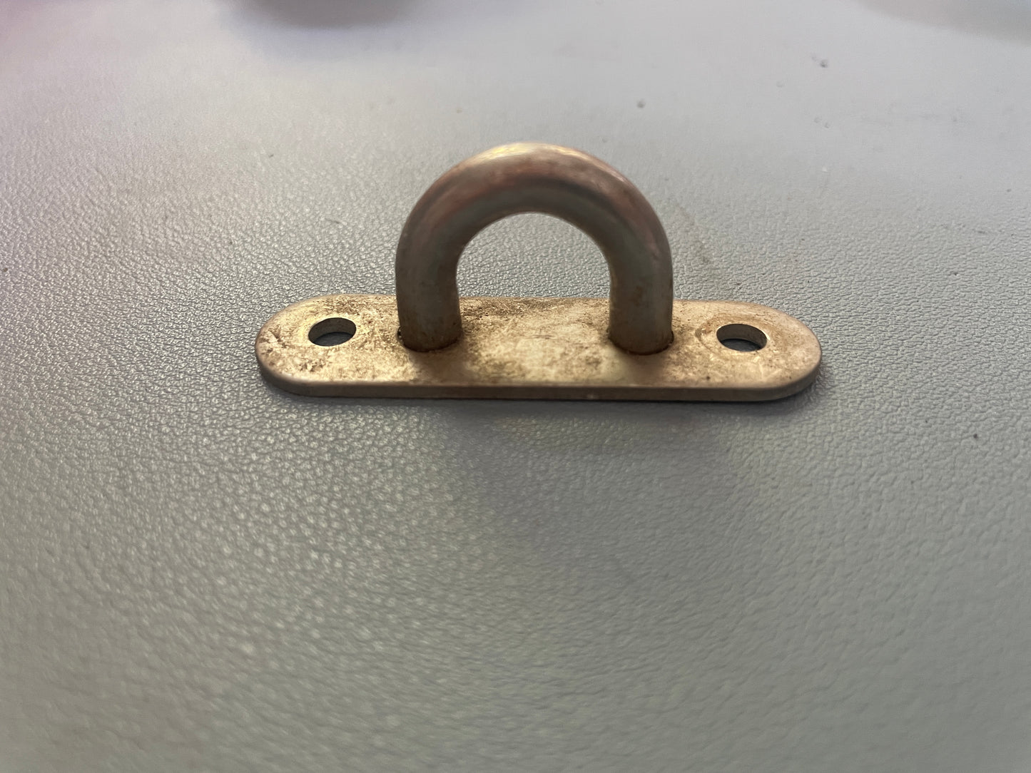 Metal U-bolt on a gray background