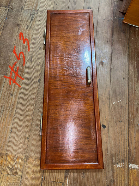 Wooden tray with a handle on a wooden surface