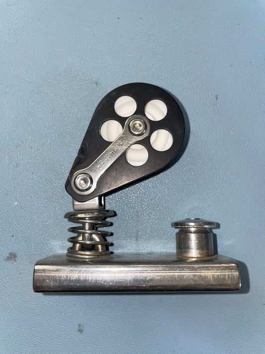 Mechanical pulley system on a light blue background