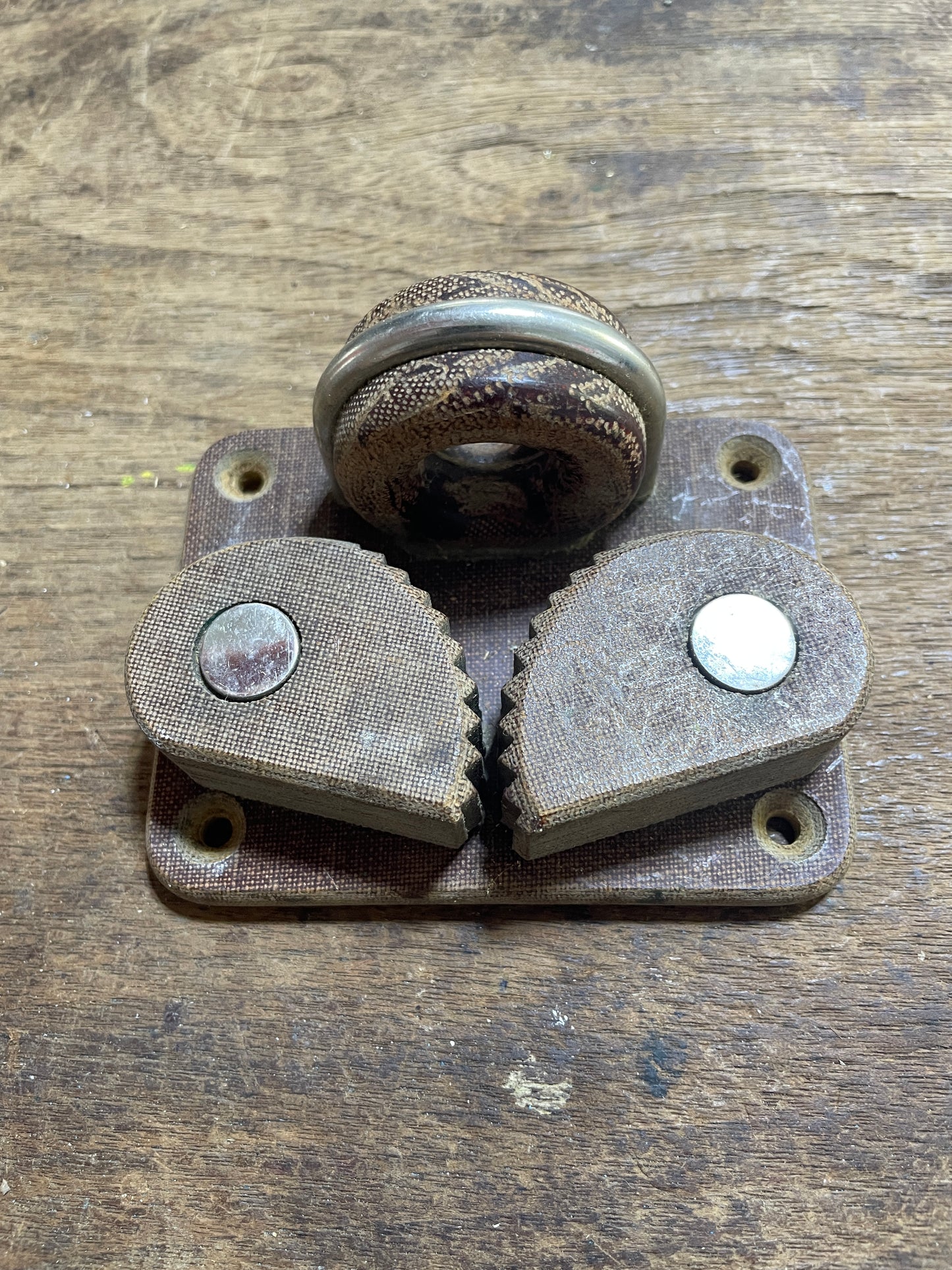 Metal gear mechanism on a wooden surface