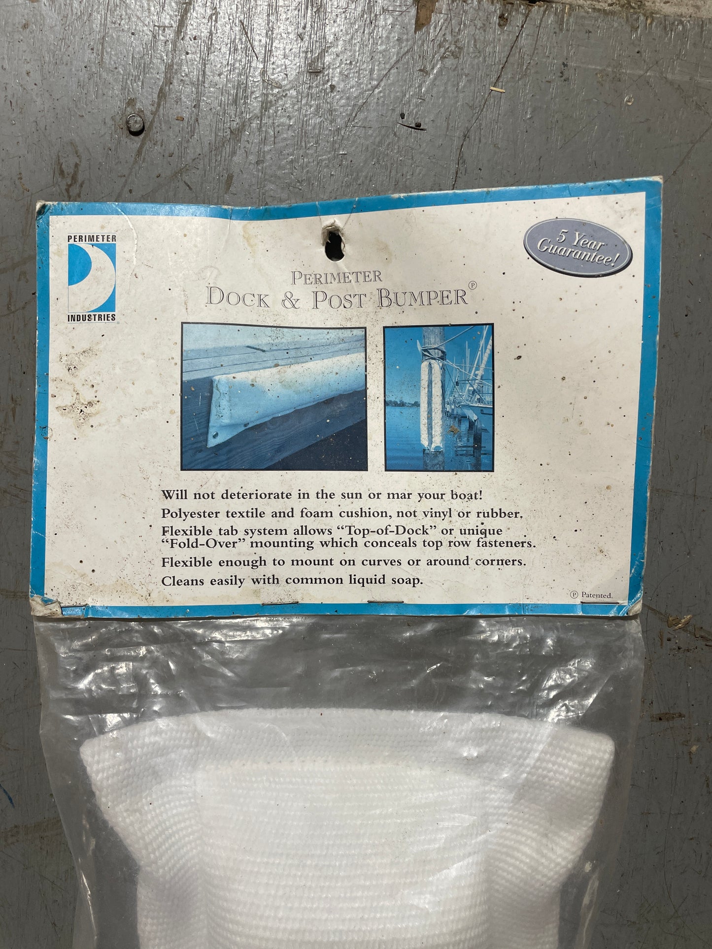 Packaged dock and post bumper with instructions on a metal surface