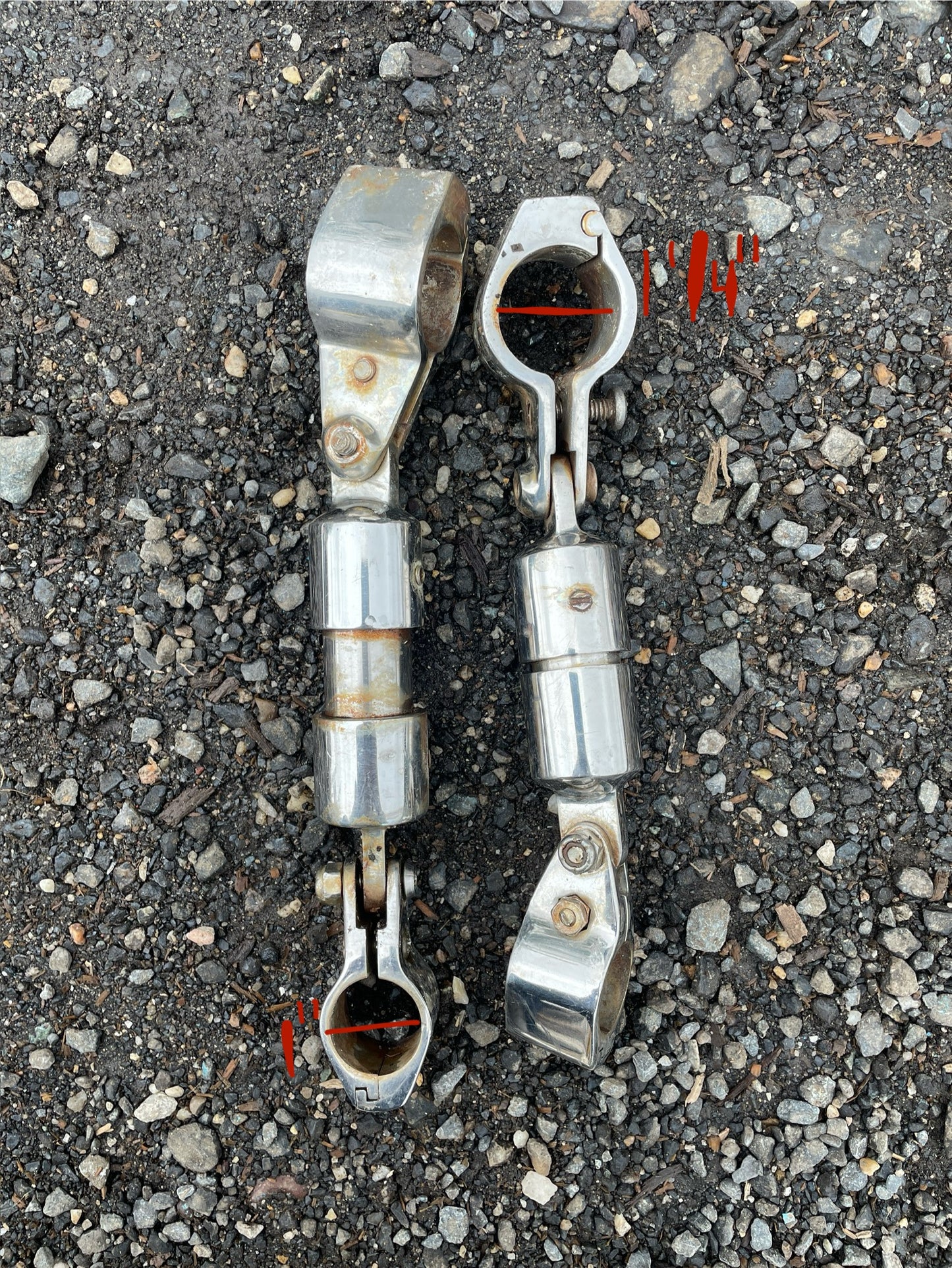 Metallic clamp or connector on a textured gray surface