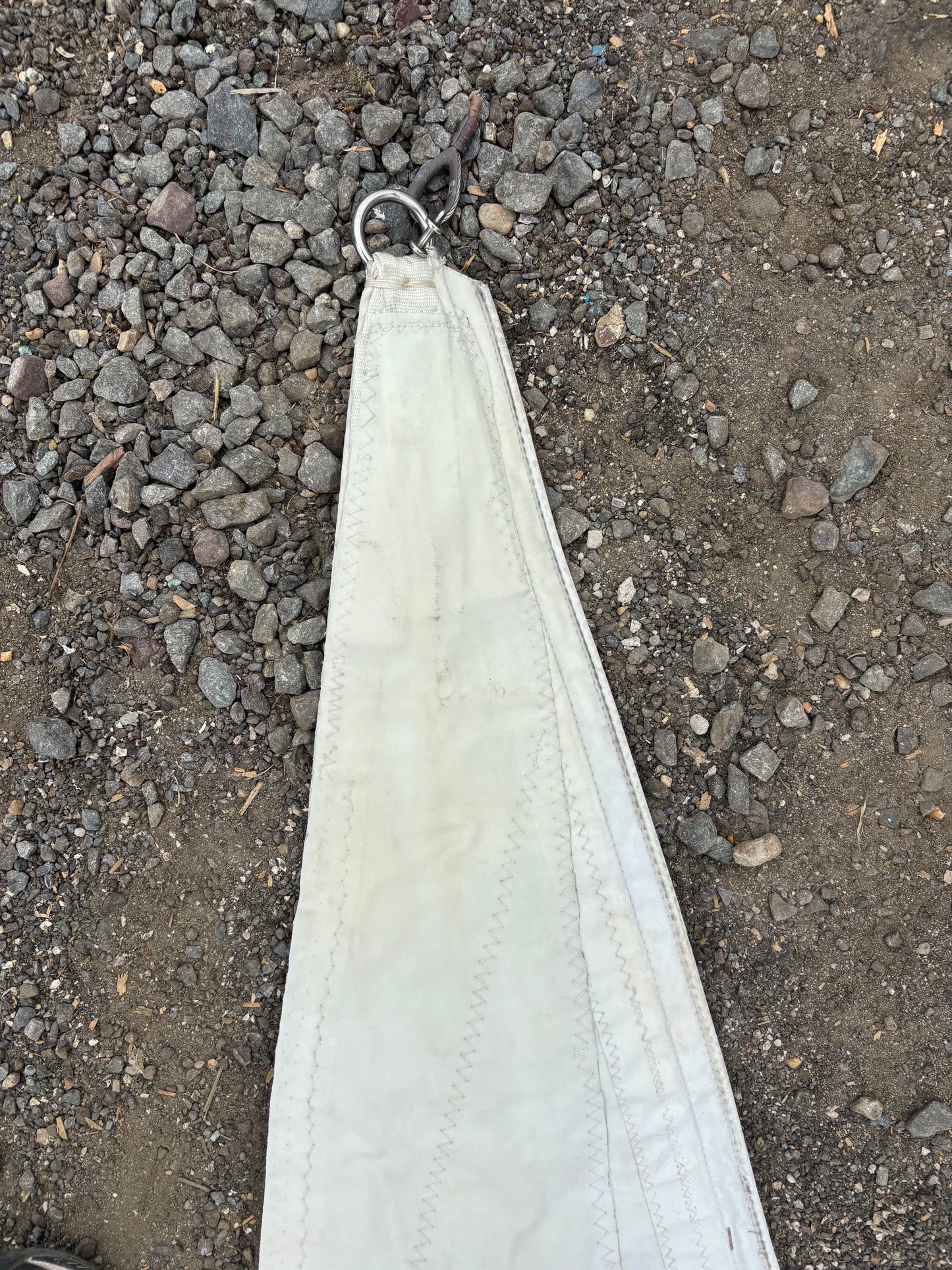 White face mask on a gravel surface