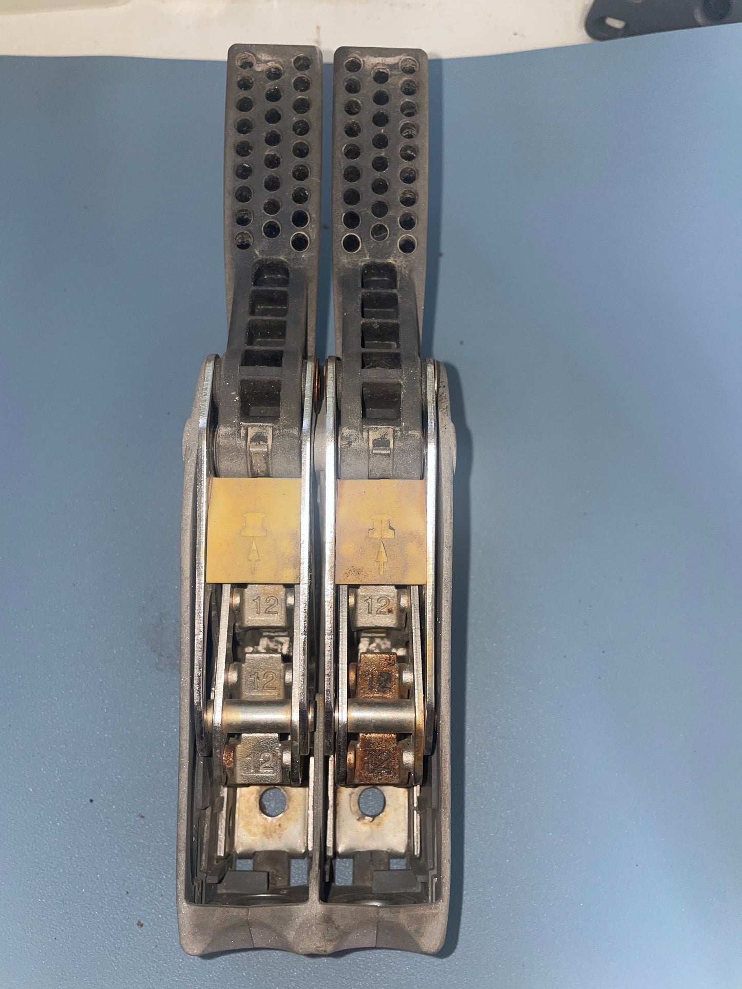 Metallic object with multiple components on a blue background