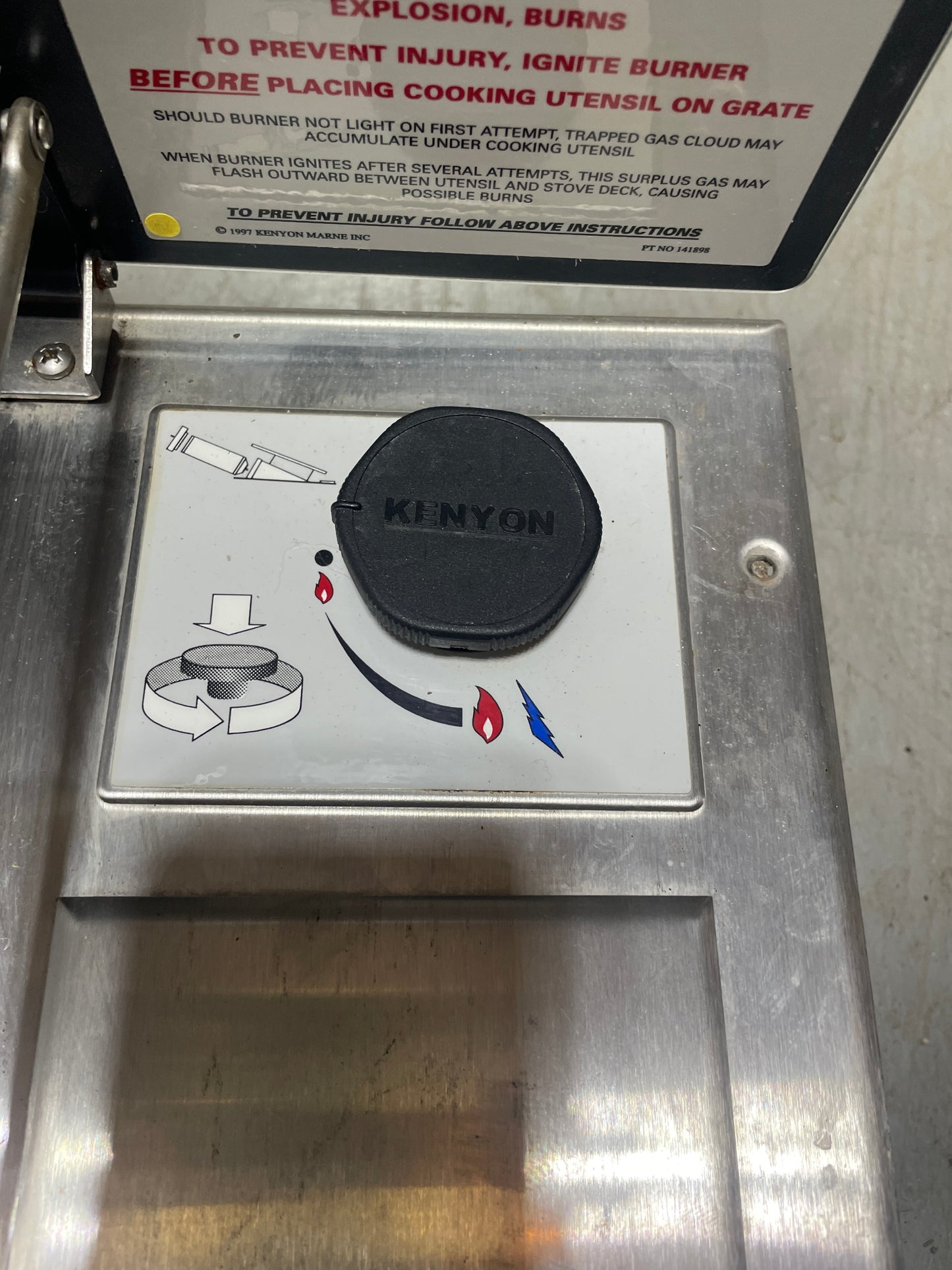 Metallic control panel with a 'KINYON' brand label on a stainless steel surface.