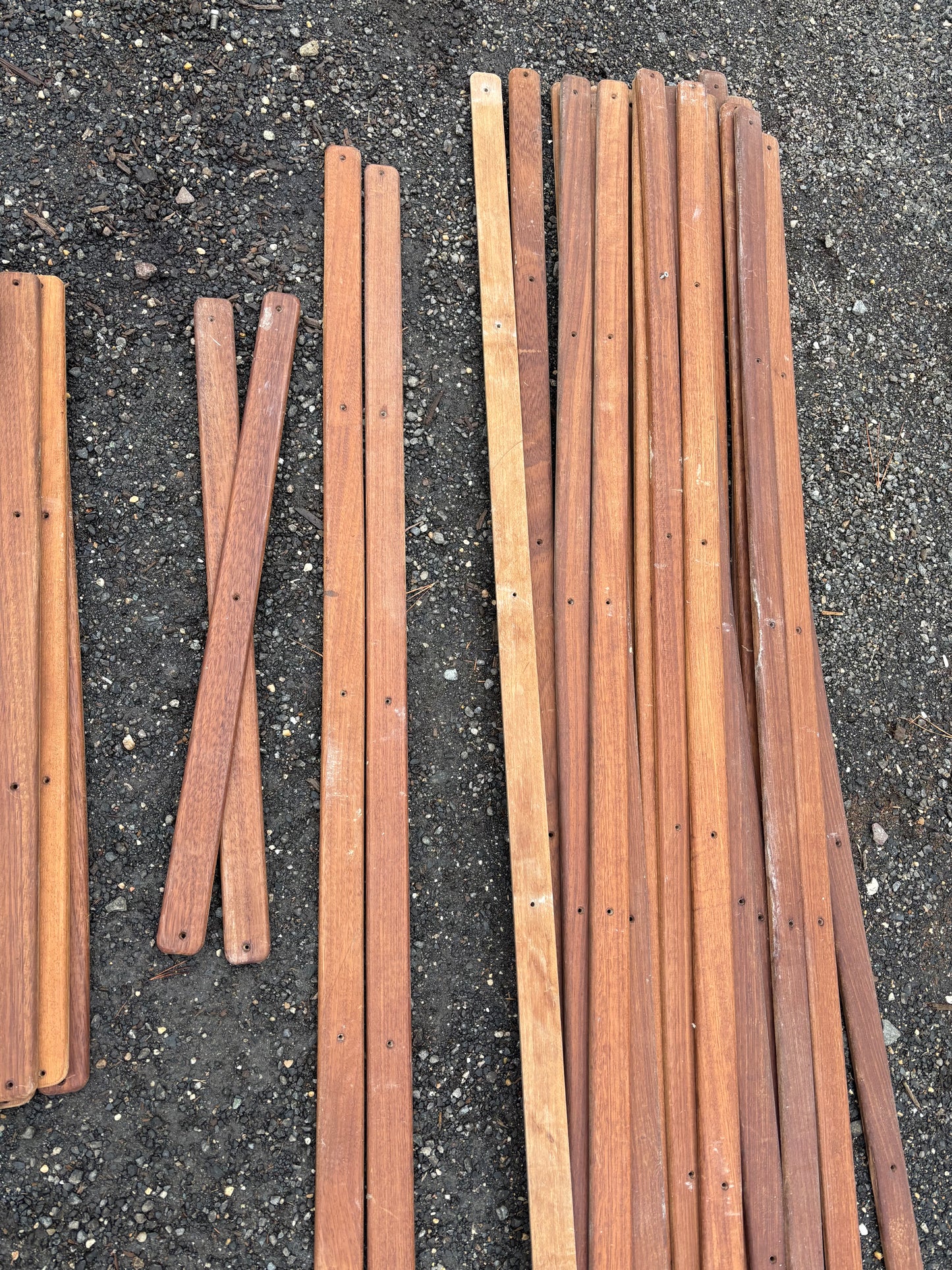 Wooden stakes or rods on a concrete surface
