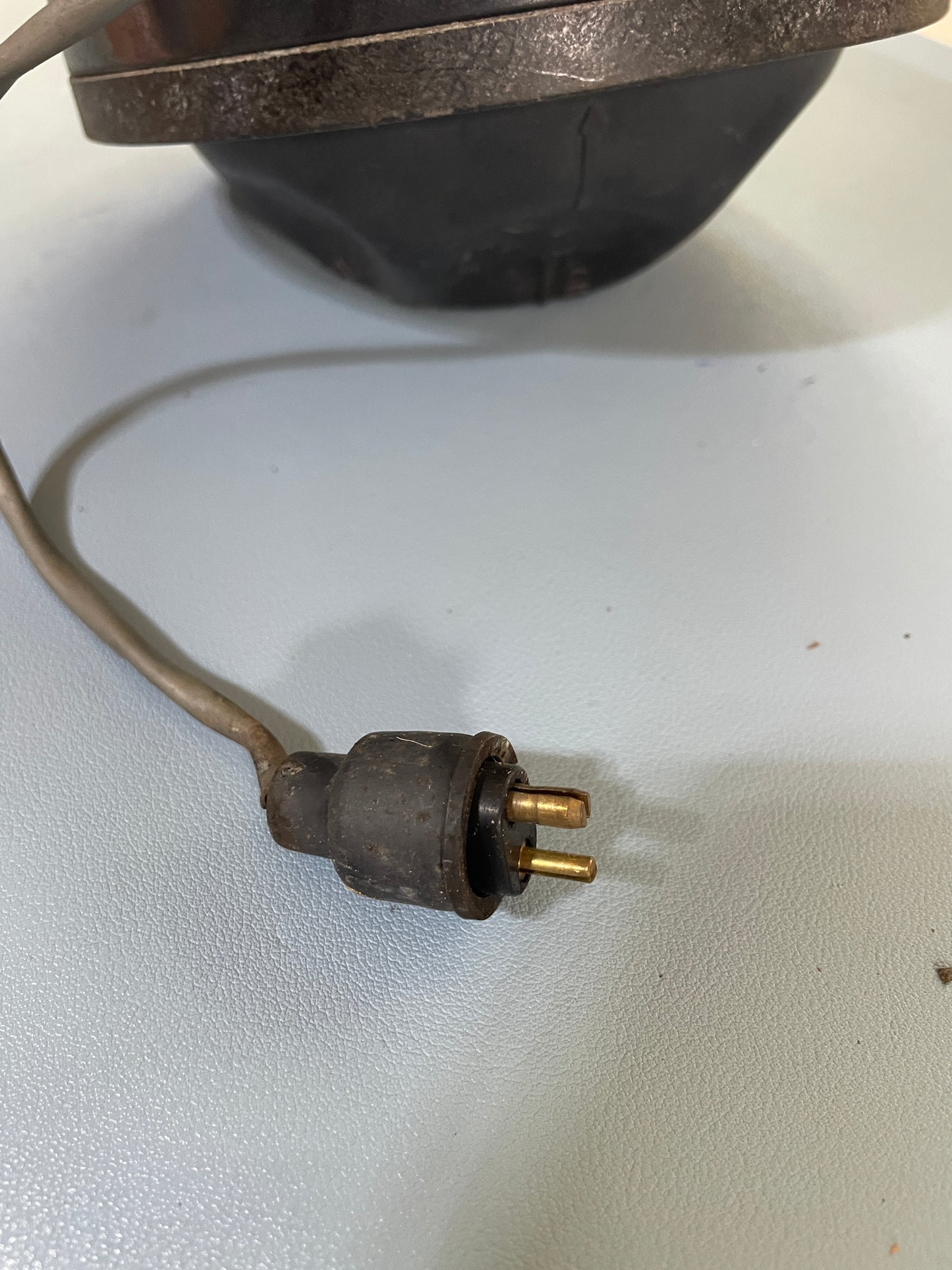 Old-style electrical plug on a white background