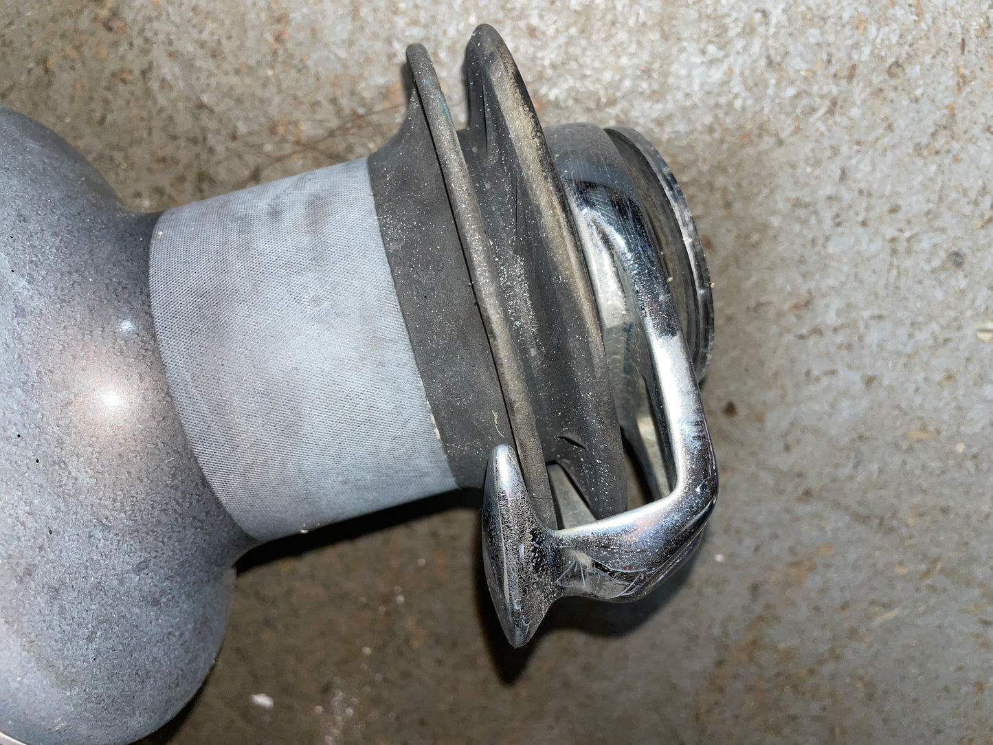 Metallic valve or fitting on a concrete surface