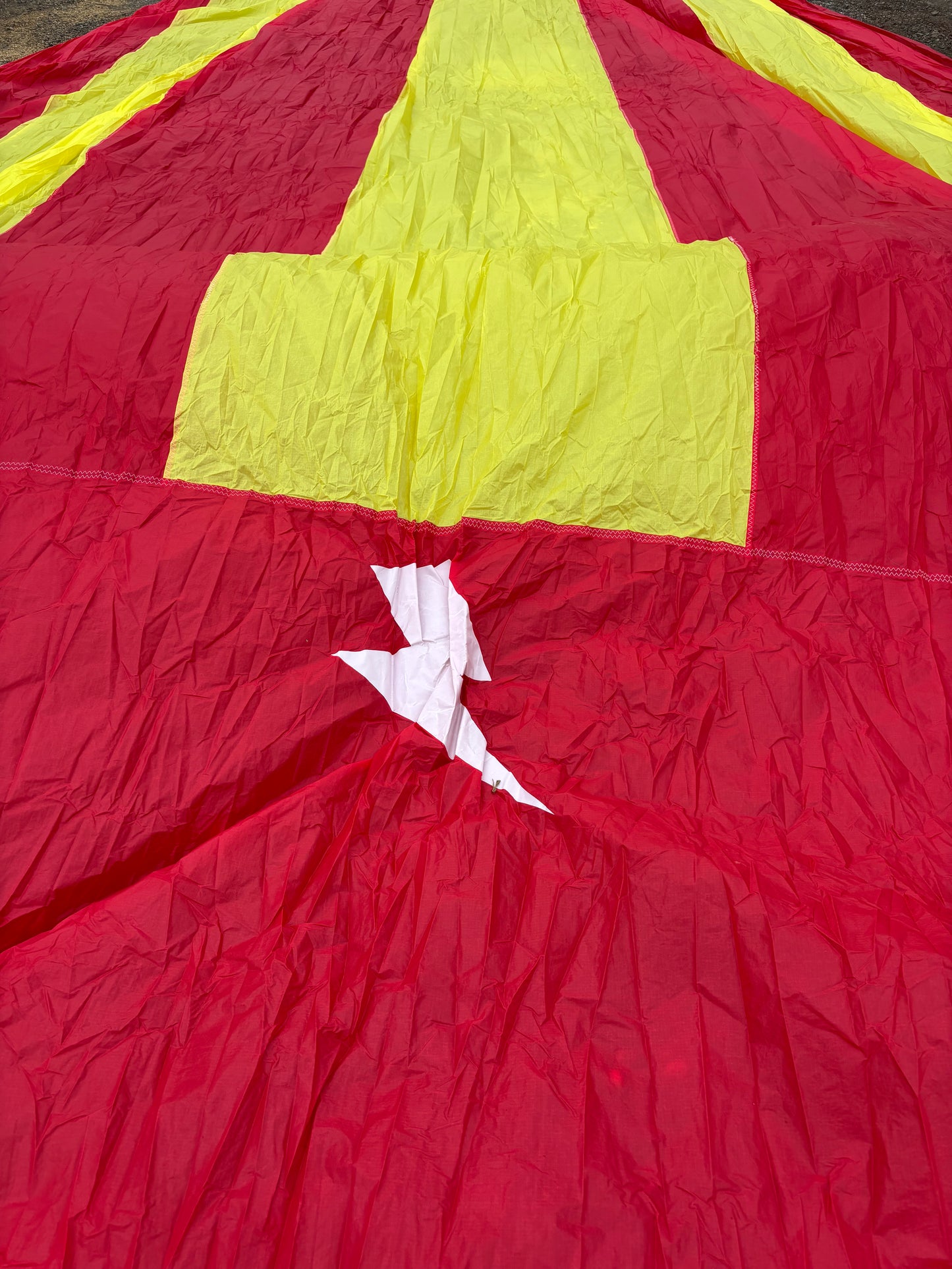 logo on yellow red spinnaker
