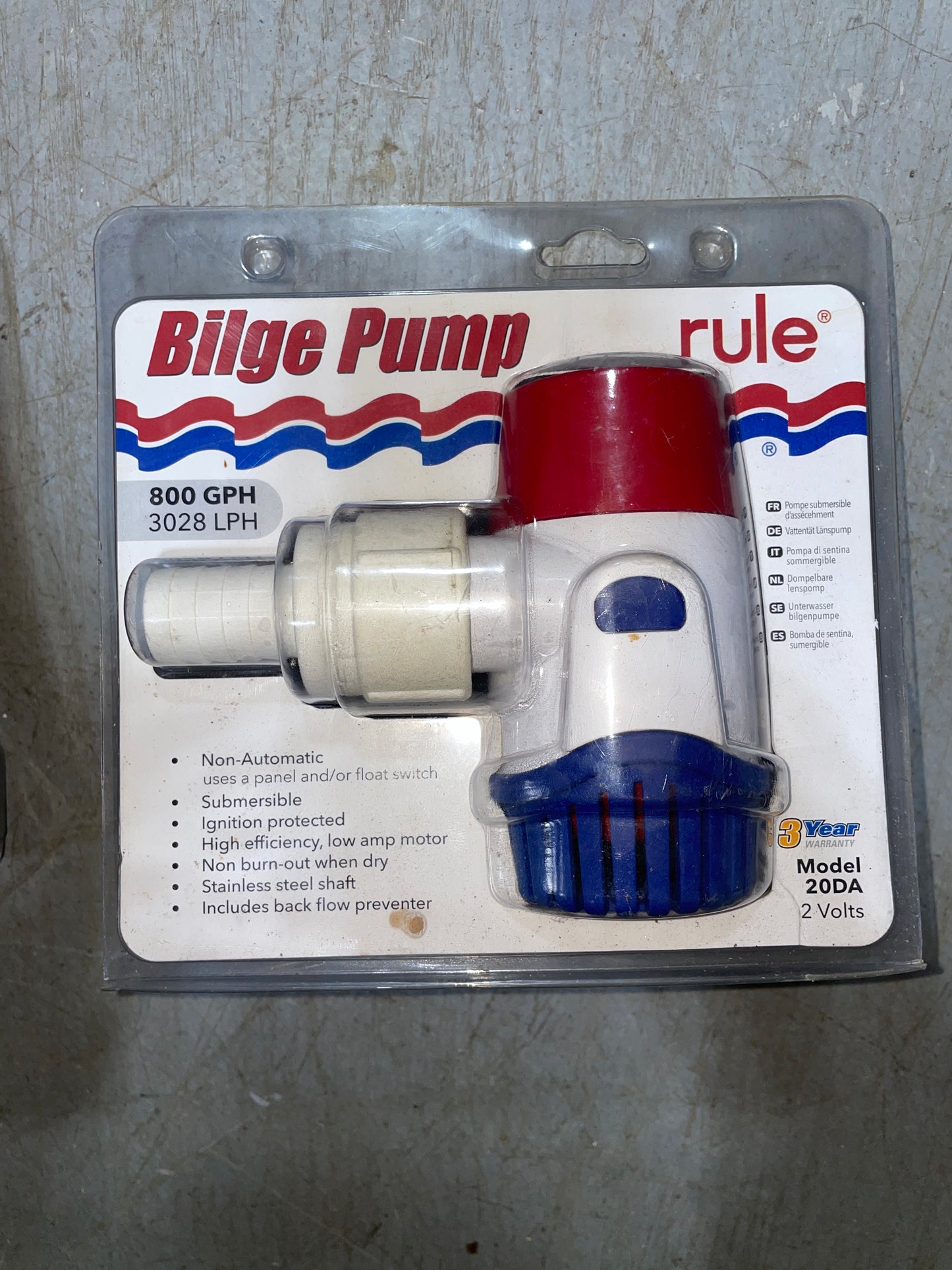 Rule bilge pump in packaging on a gray surface