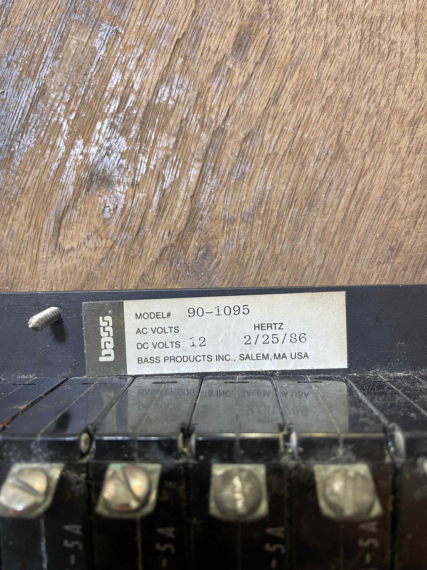 Electrical component with a label on a wooden surface