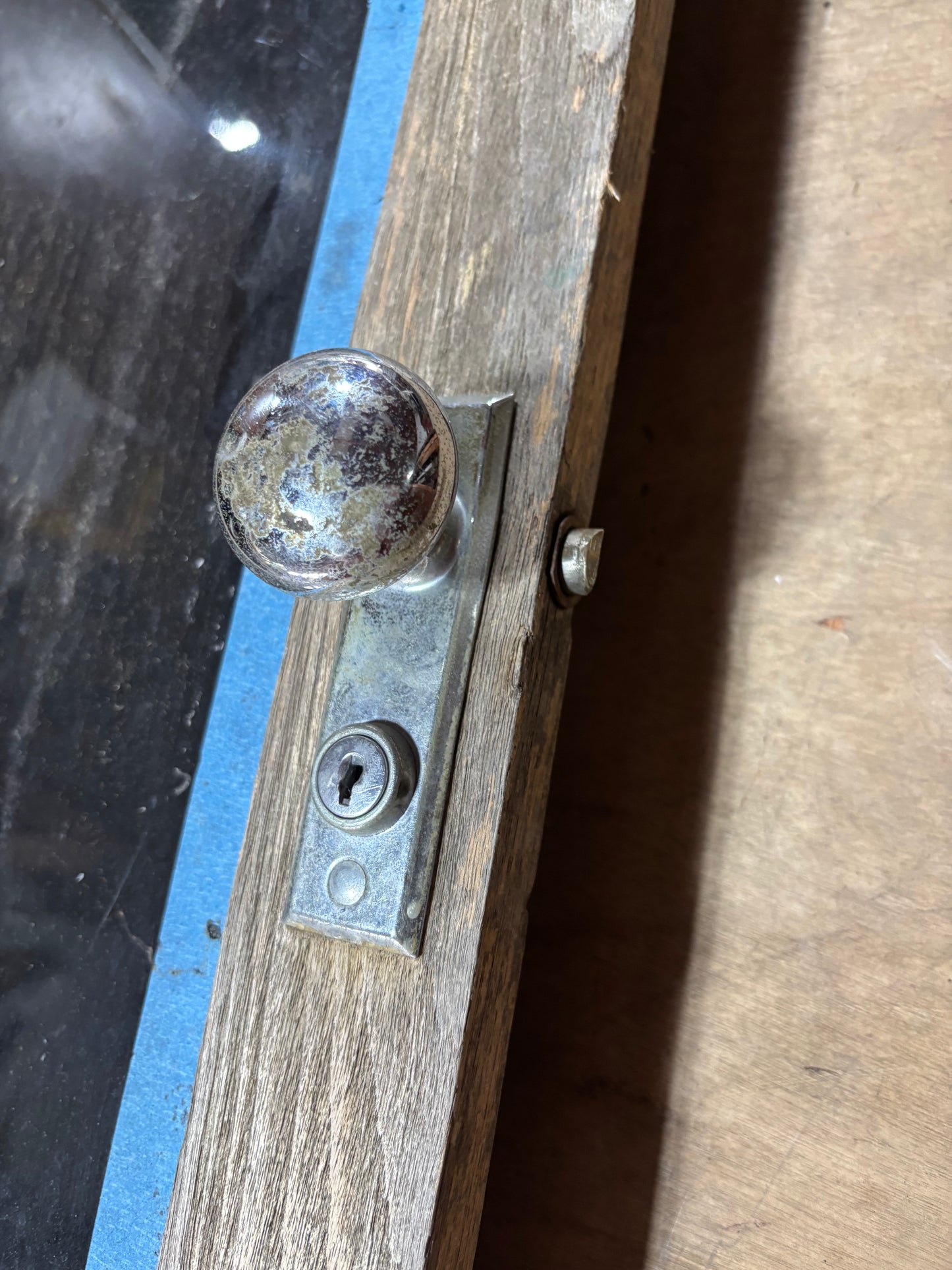 Wooden door with metal handle and keyhole